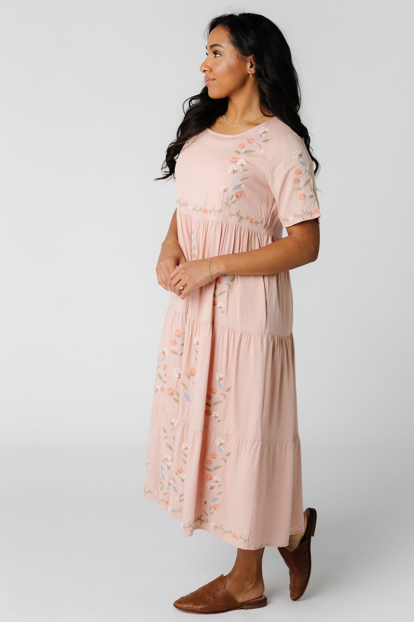 Light pink tiered midi dress embroidery details and short embroidered sleeves
