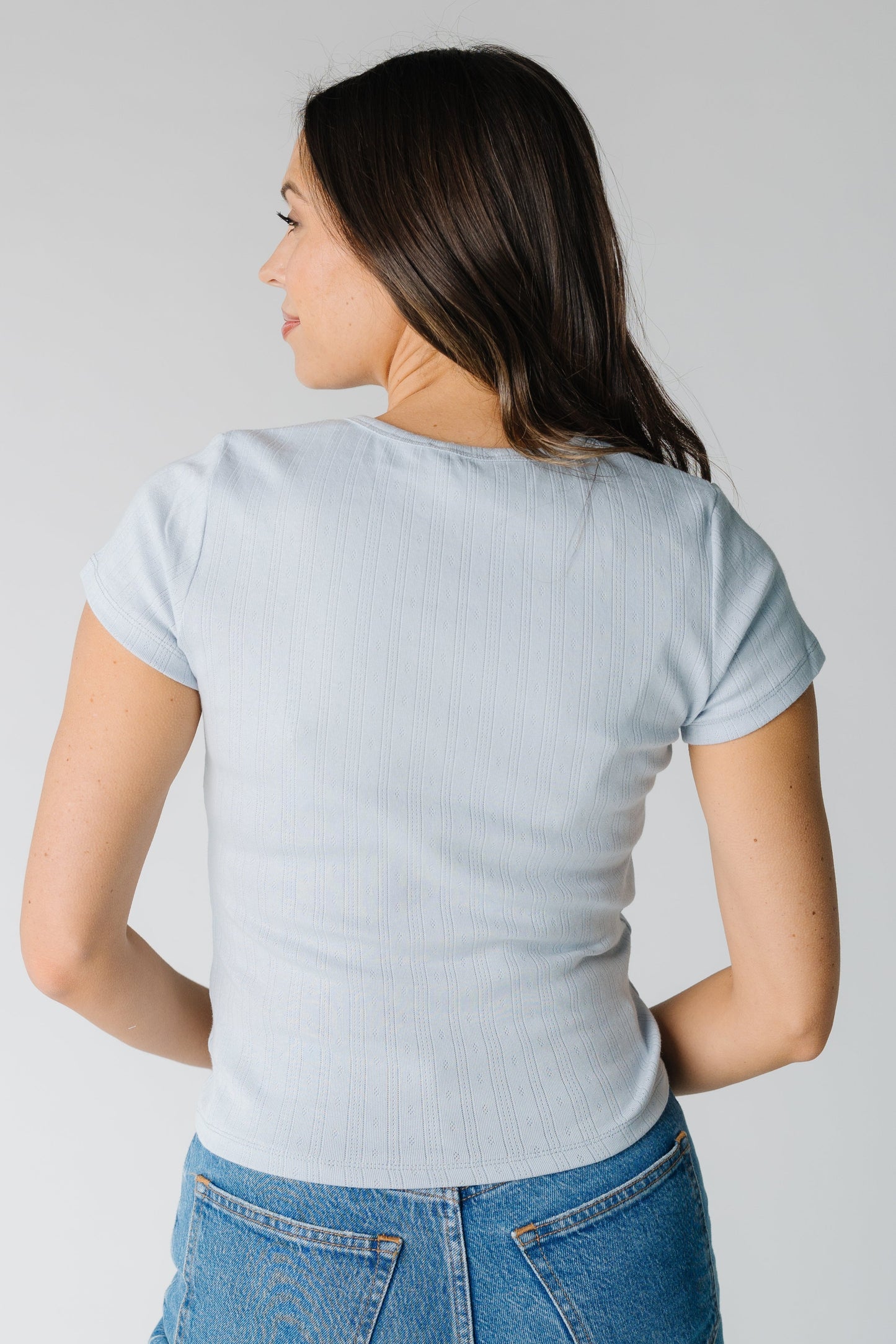 Back view of blue short sleeve pointelle top