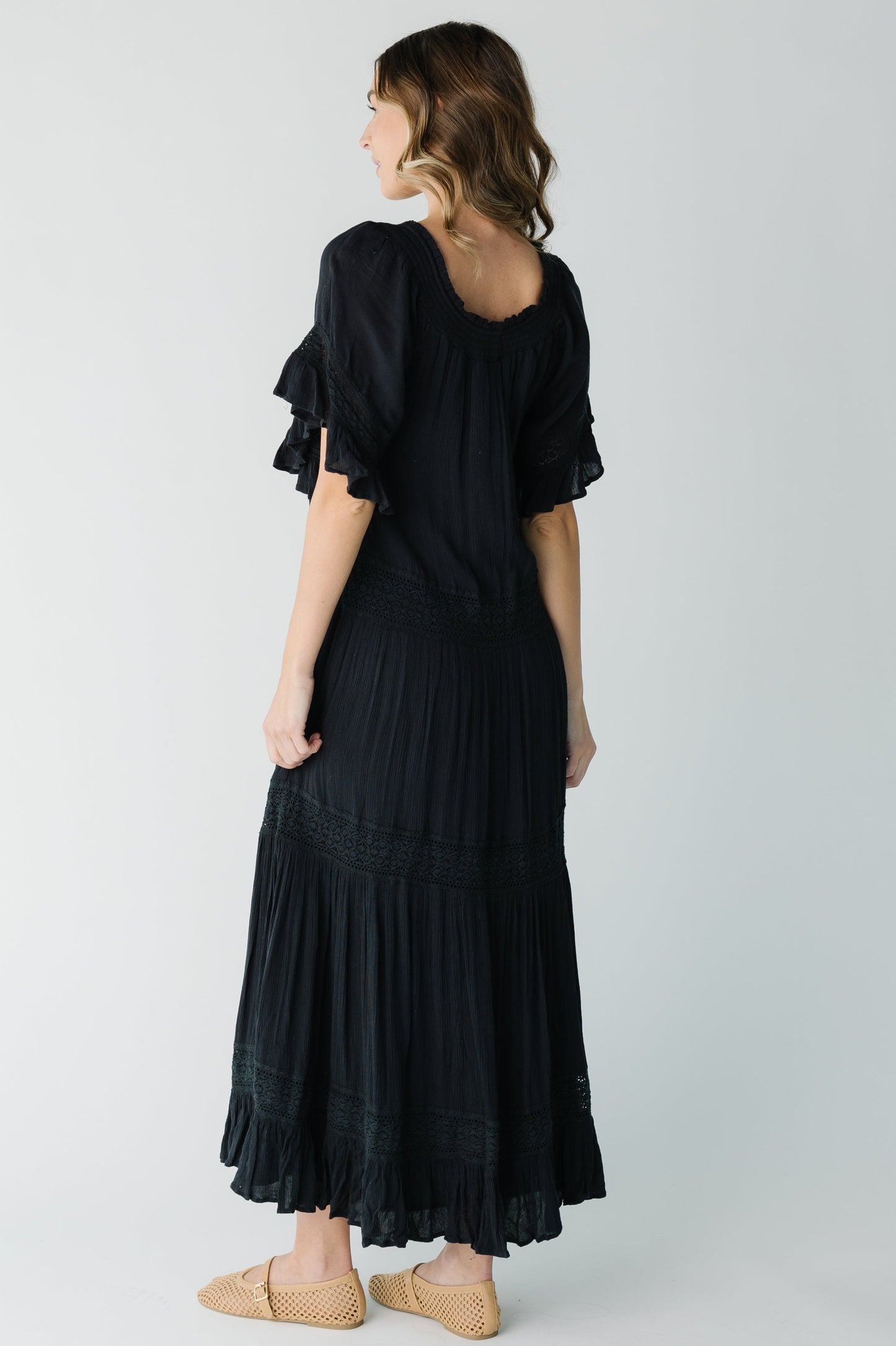 Back view of black scoop neck maxi with short sleeves