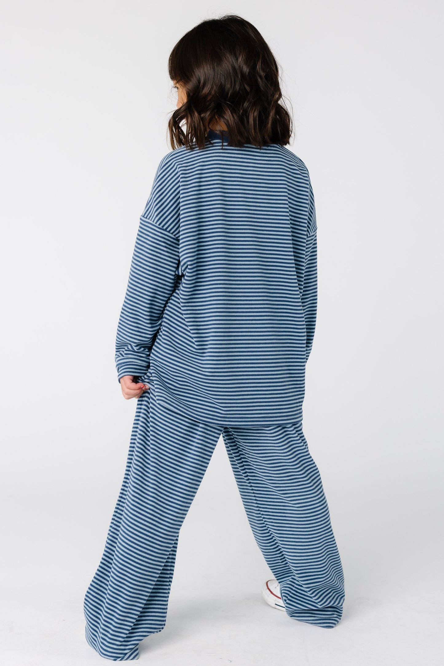 Back view of a girl wearing a blue stripe lounge set