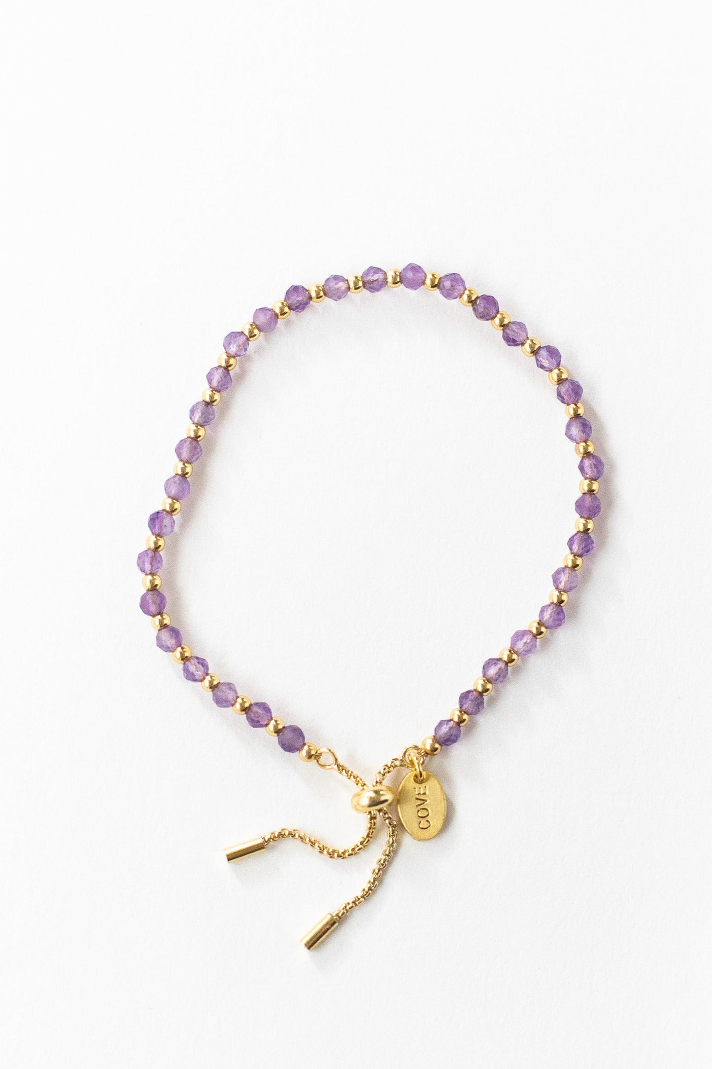 Baby bracelet in purple and gold beads