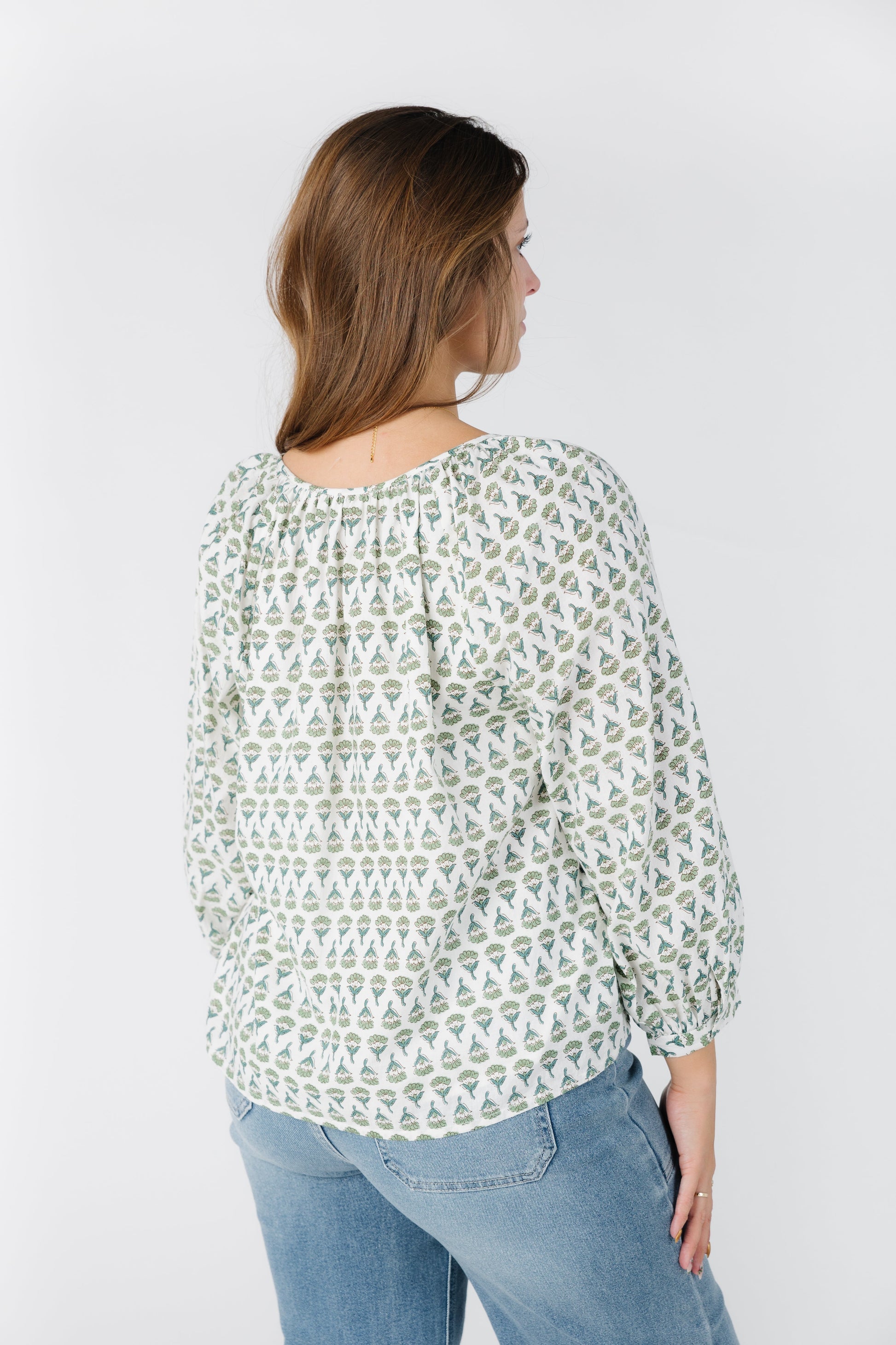 Back view of white print top