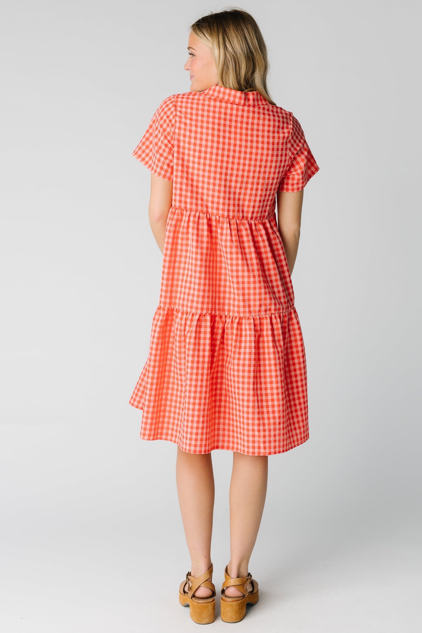 Back view of tiered knee length dress with short sleeves