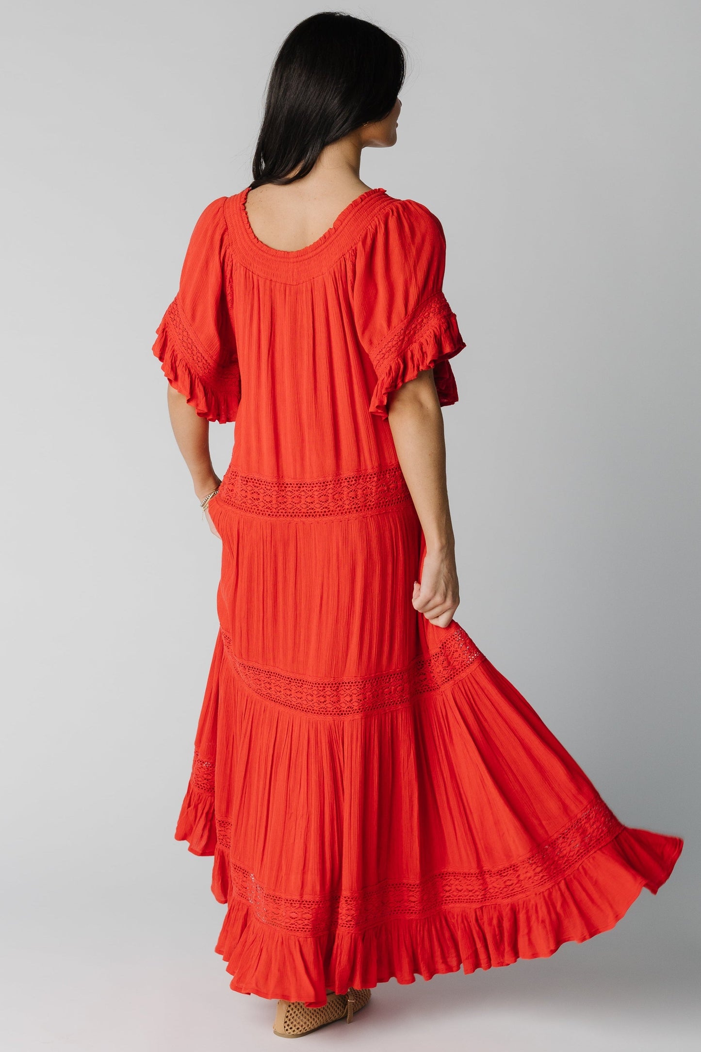 Back view of red gauzy midi dress
