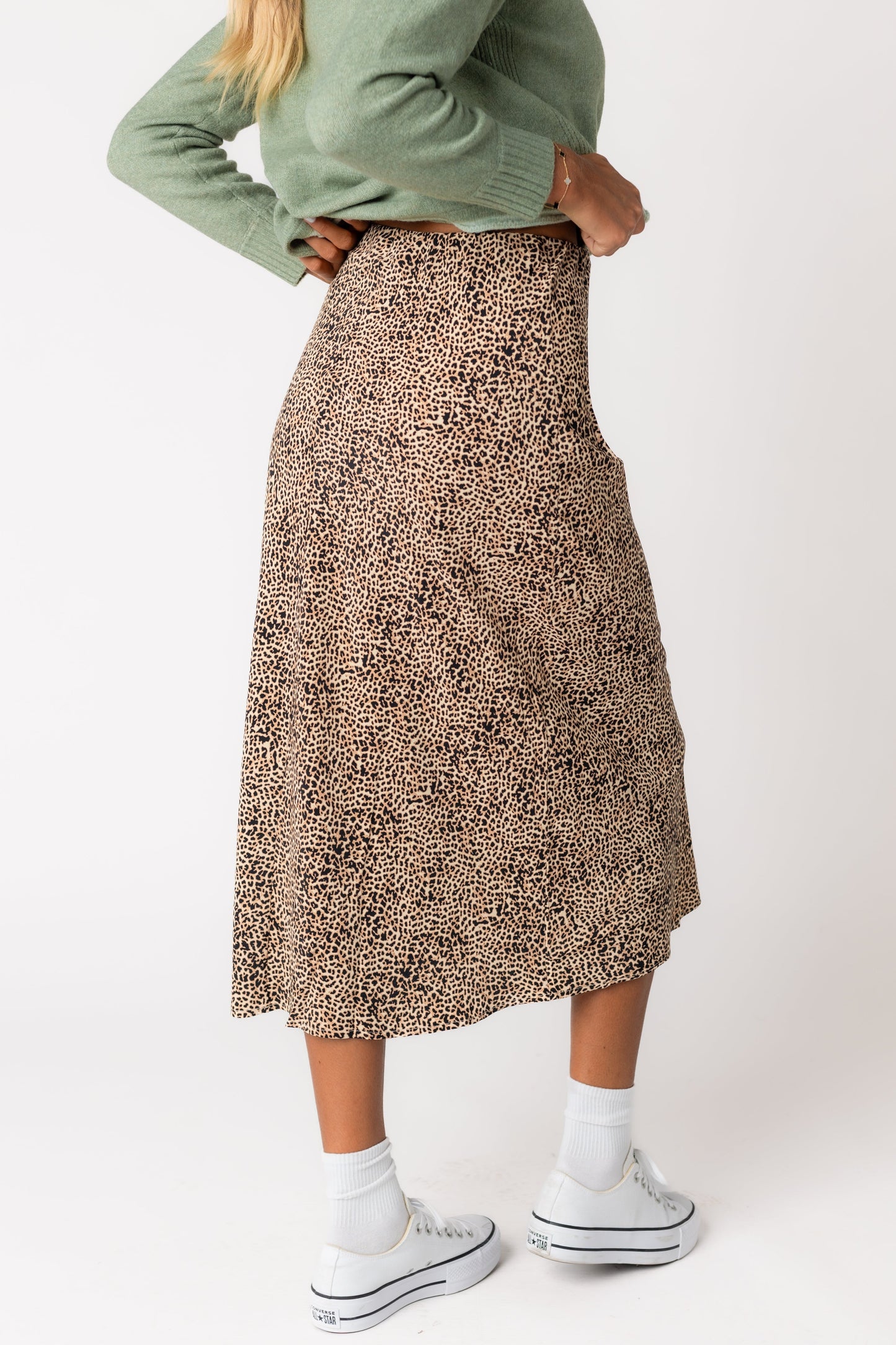 Back view of of brown leopard patterned midi skirt