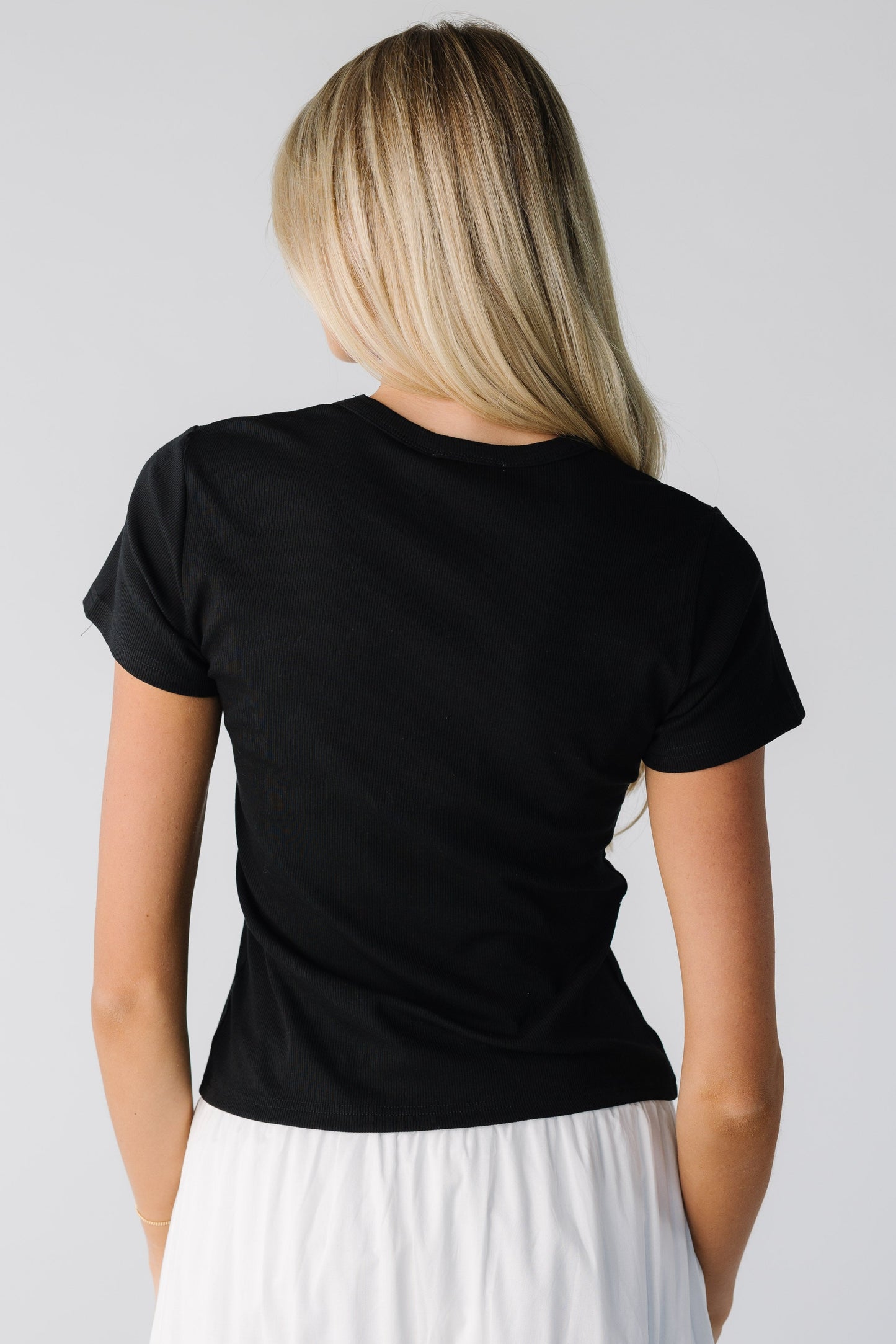 Back view of black short sleeve tee