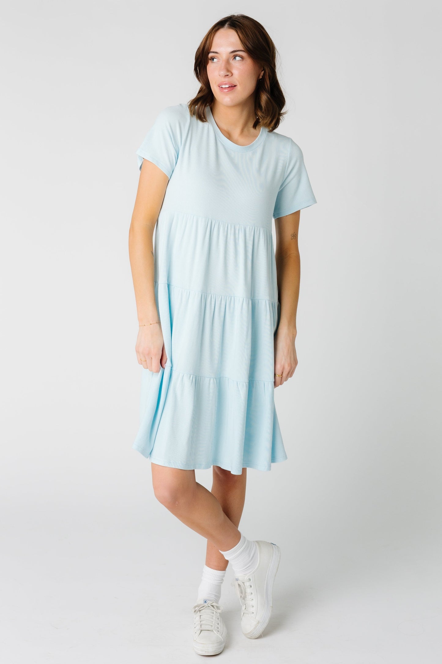 Modest women's tiered dress with short sleeves in light blue