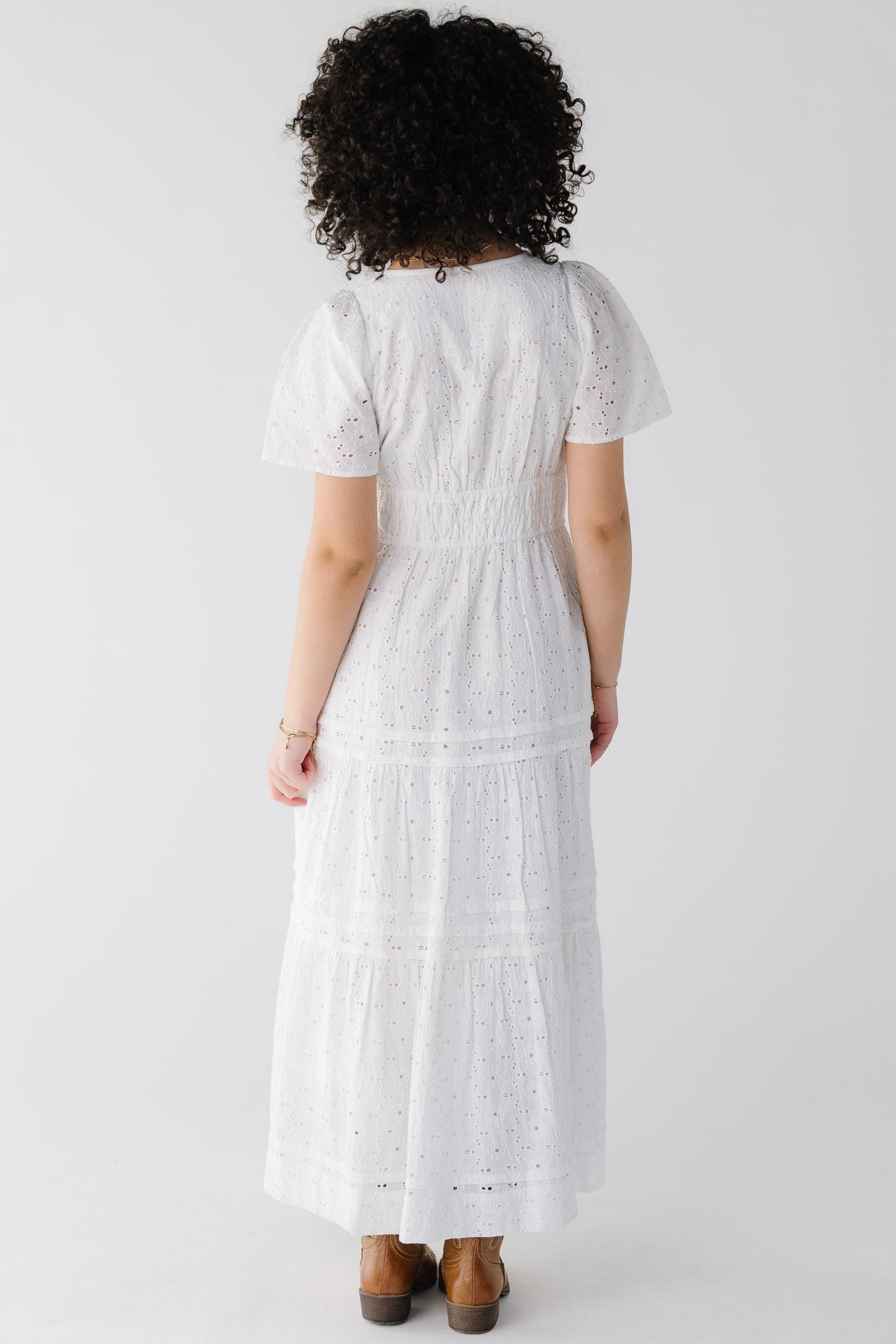 Back view of white eyelet maxi with short sleeves and wide elastic waist
