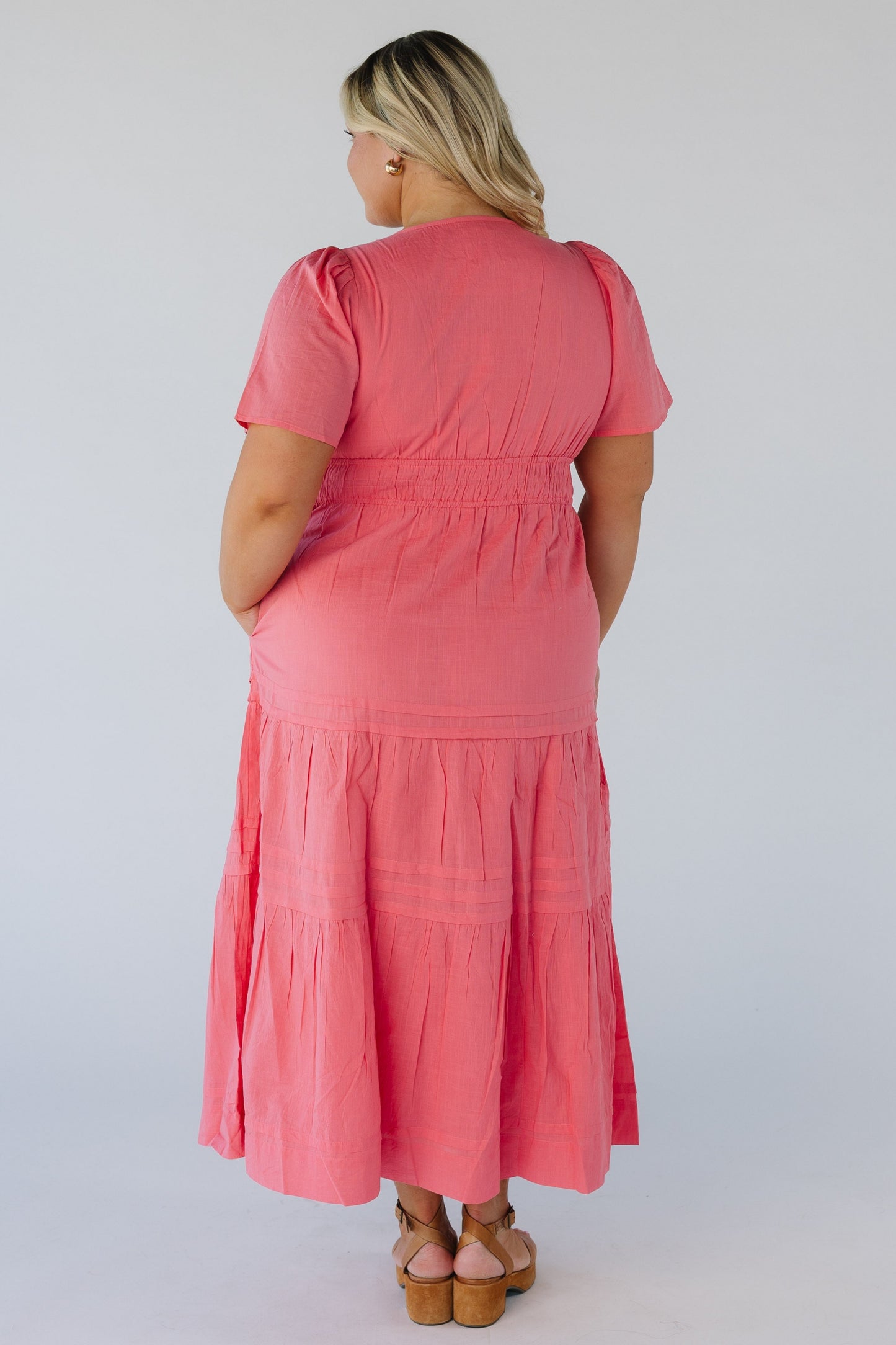 Back view of pink midi with short sleeves
