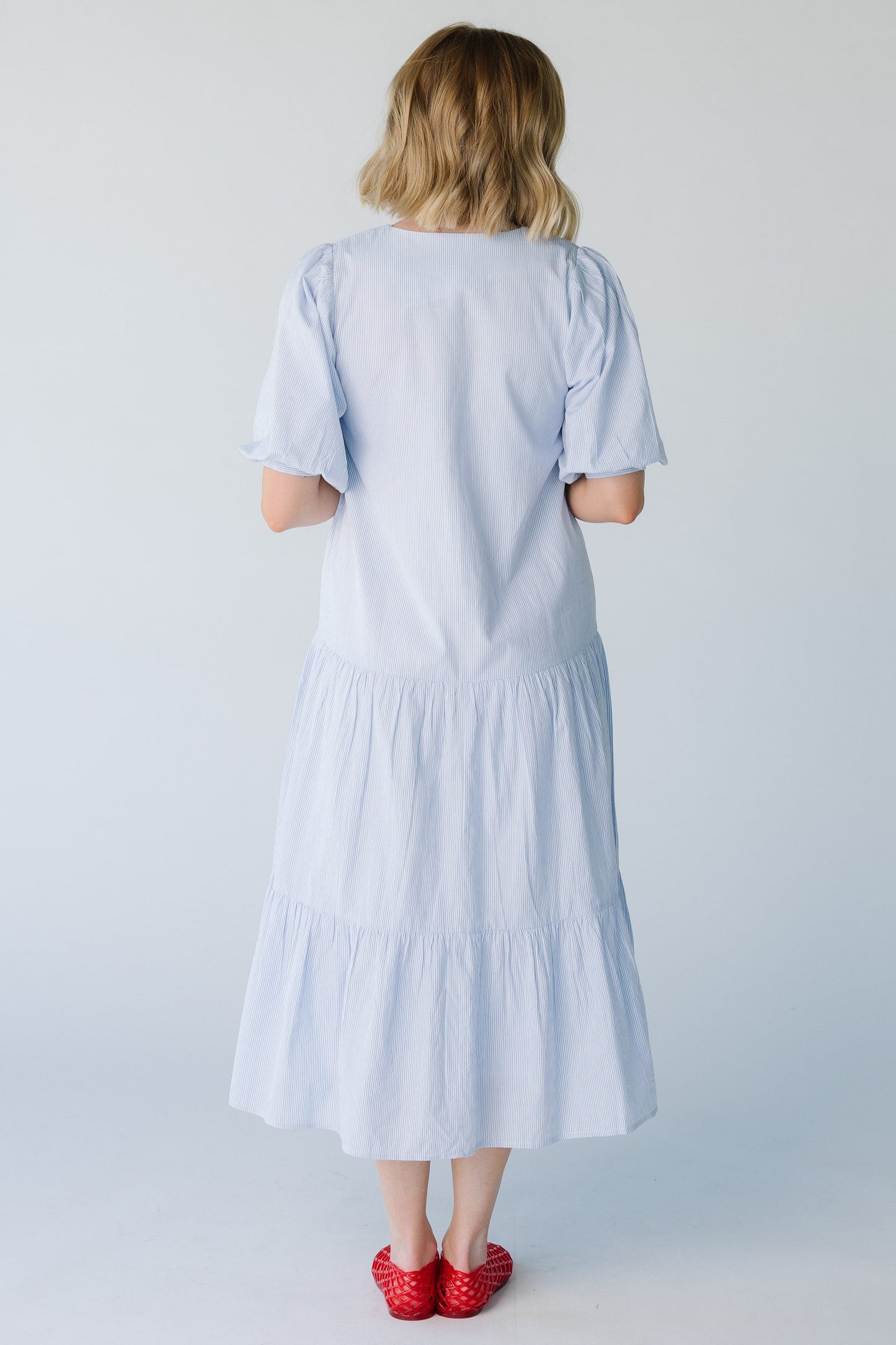 Full back length of blue stripe midi