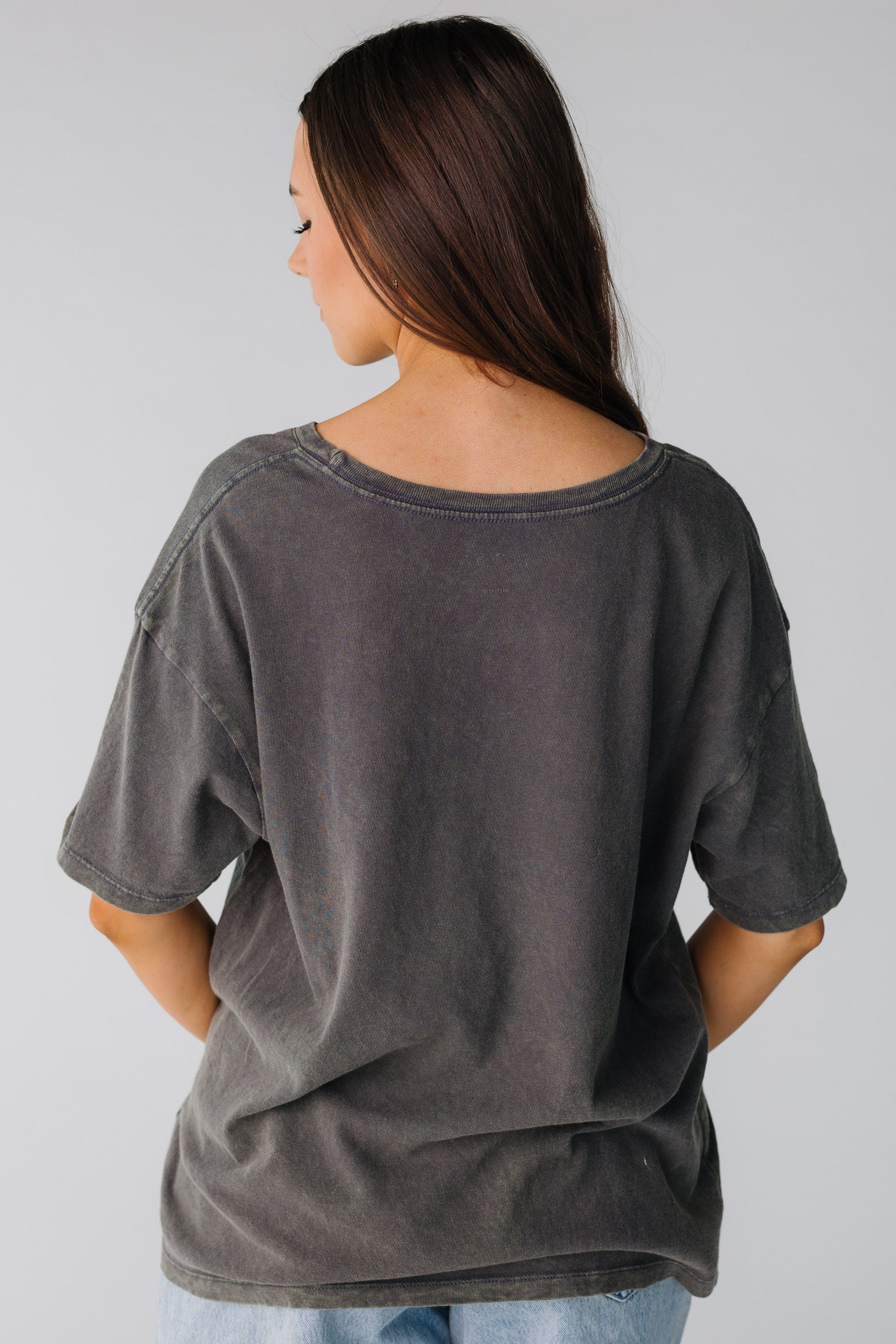 Back view of off black oversized tee with short sleeves