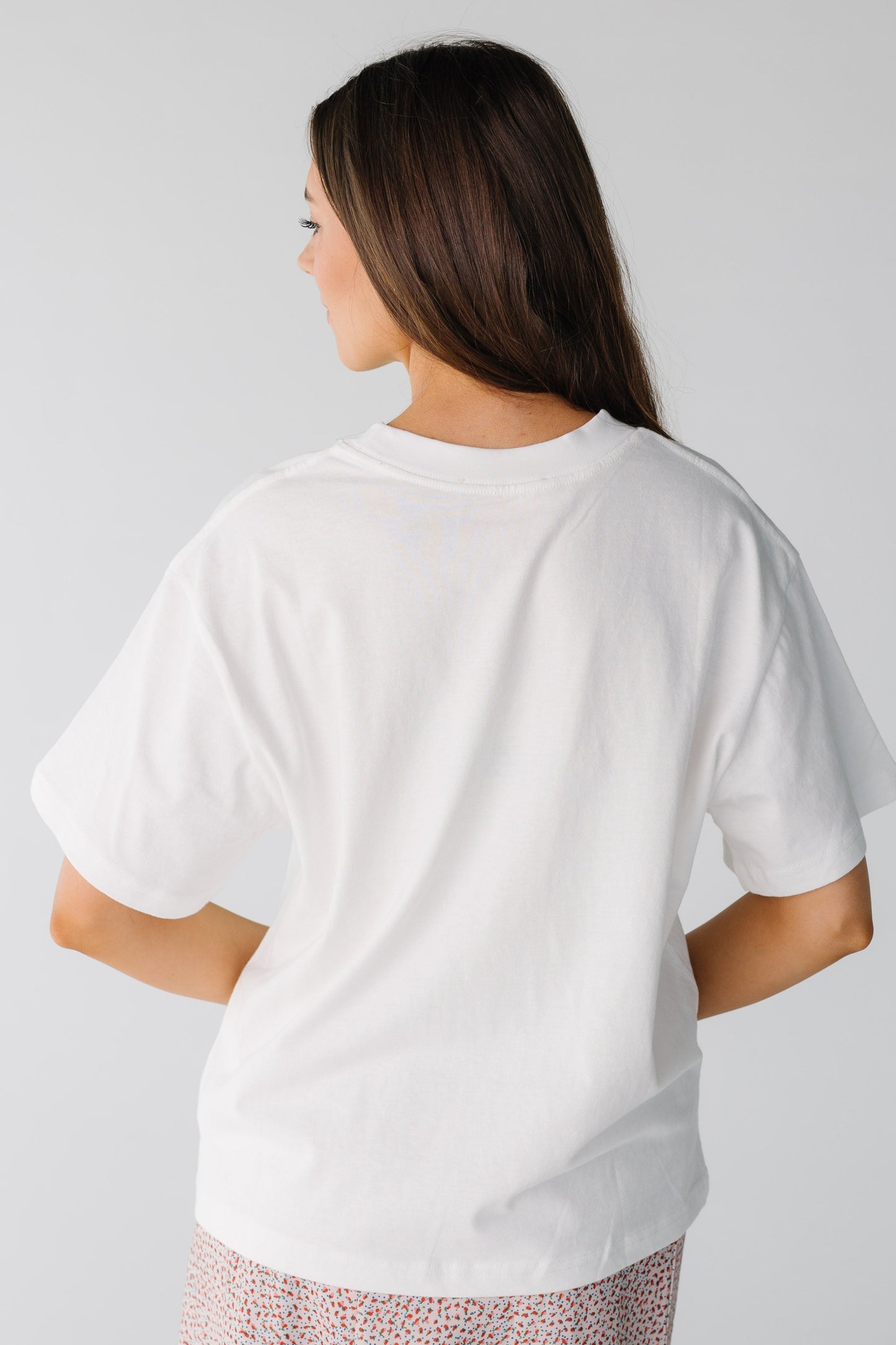 Back view of white tee