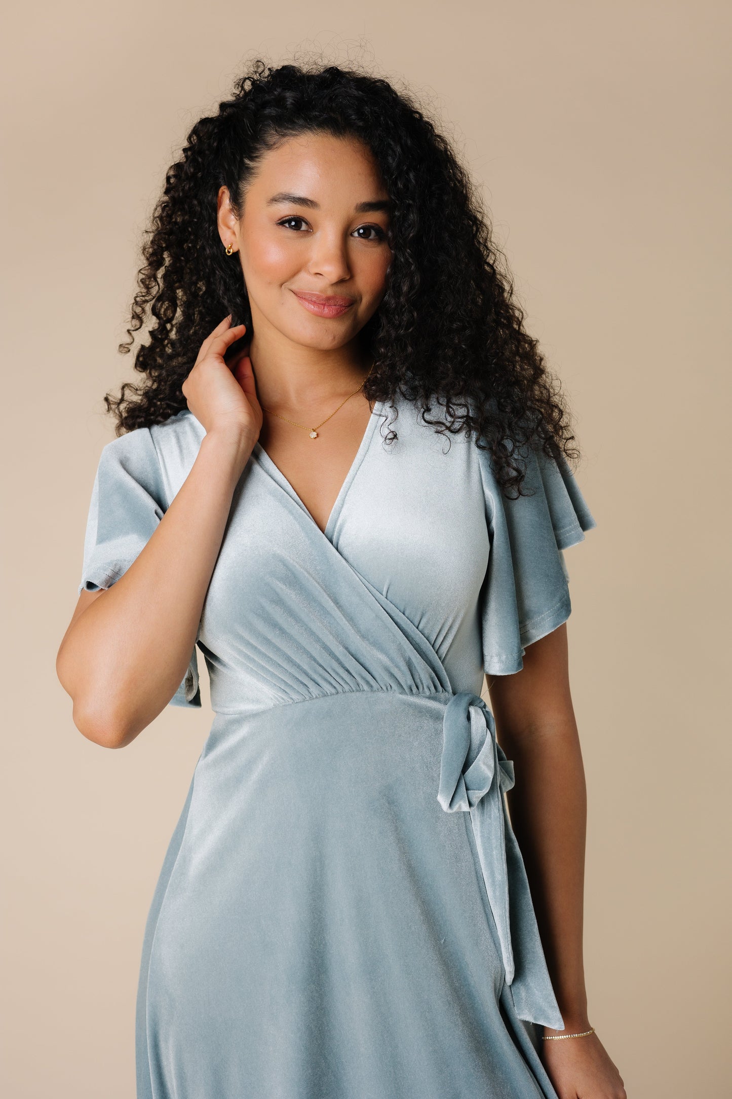 Close view of velvet wrap maxi dress in light blue