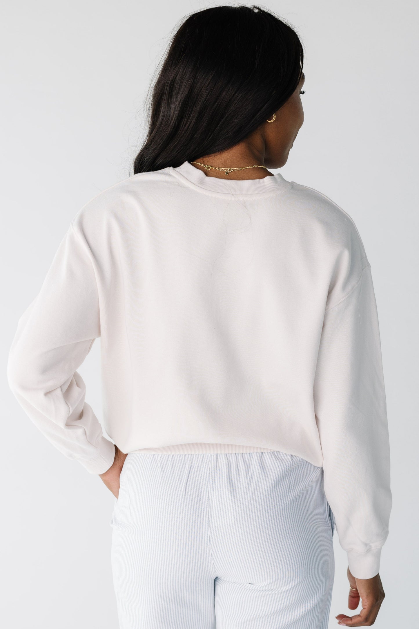 Back view of white sweatshirt