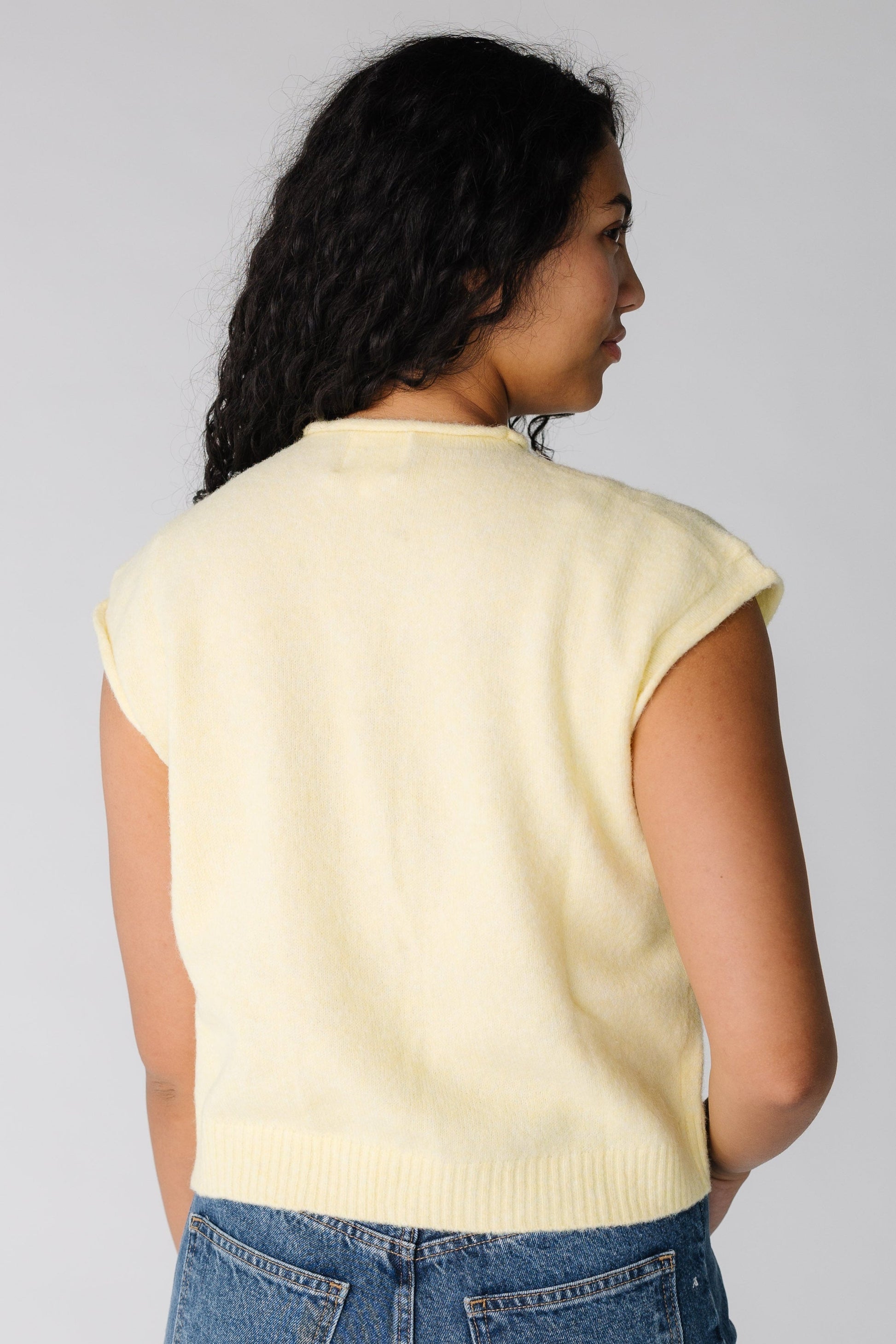 Back view of yellow sweater vest for women