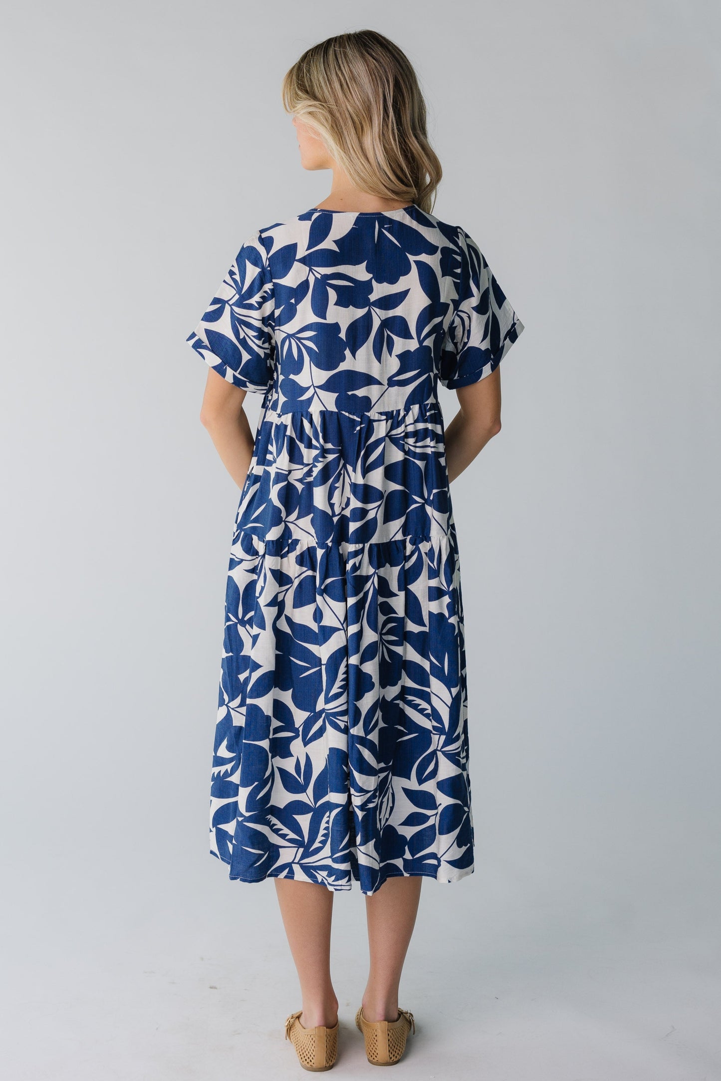 Back view of navy floral midi with short sleeves