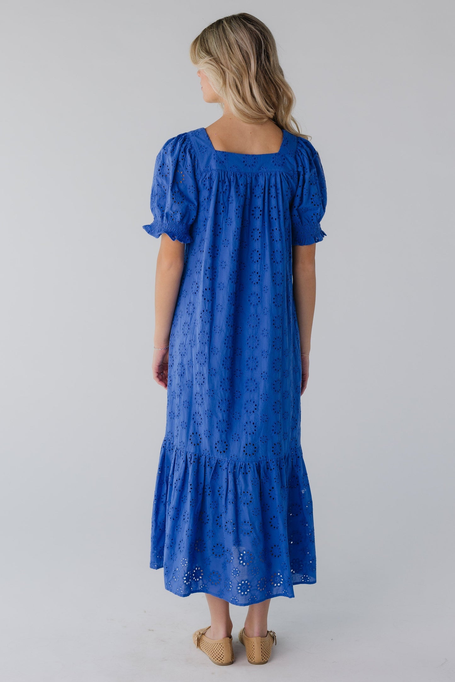 Back view of blue eyelet midi with short sleeves