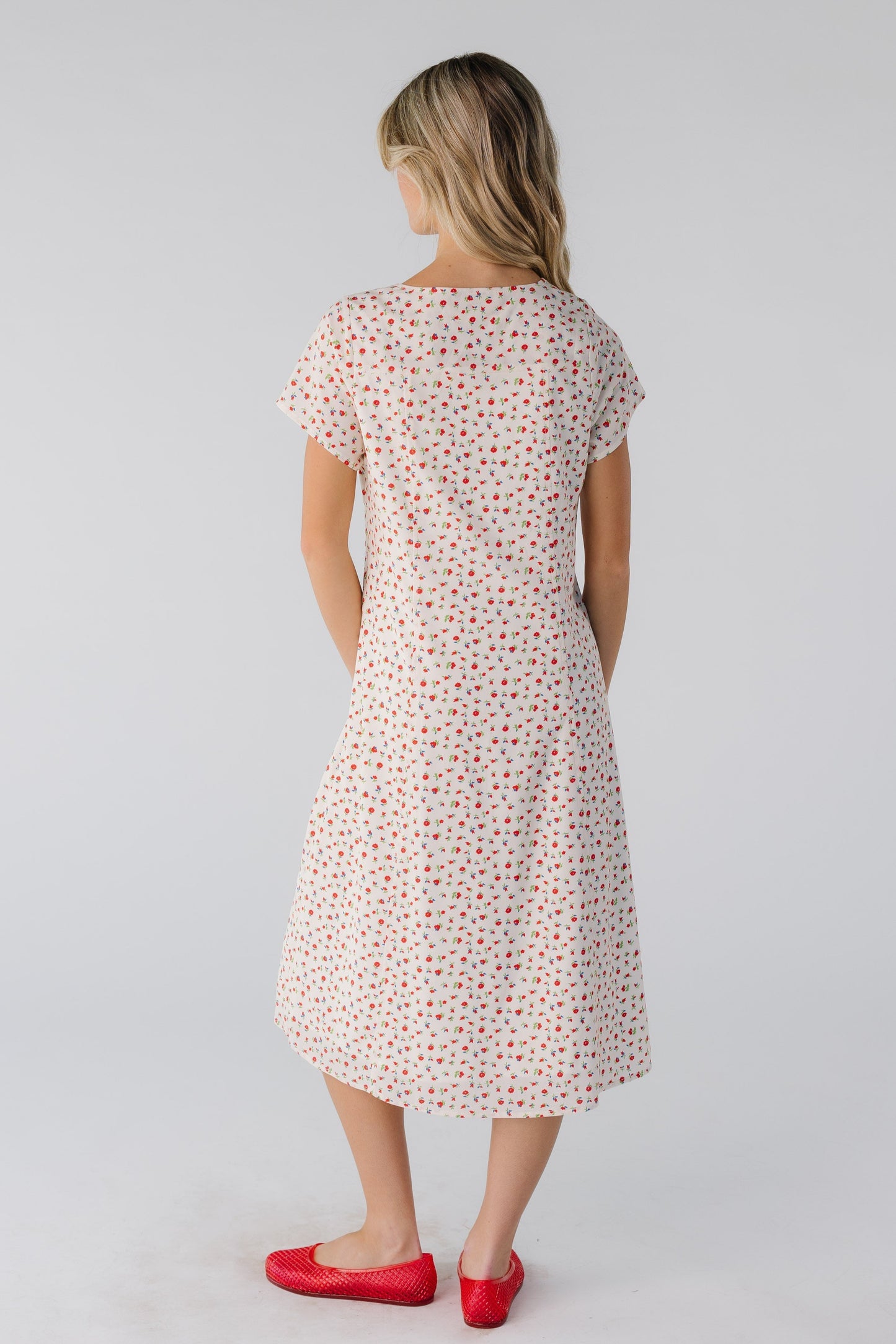 Back view of cream print midi with short sleeves