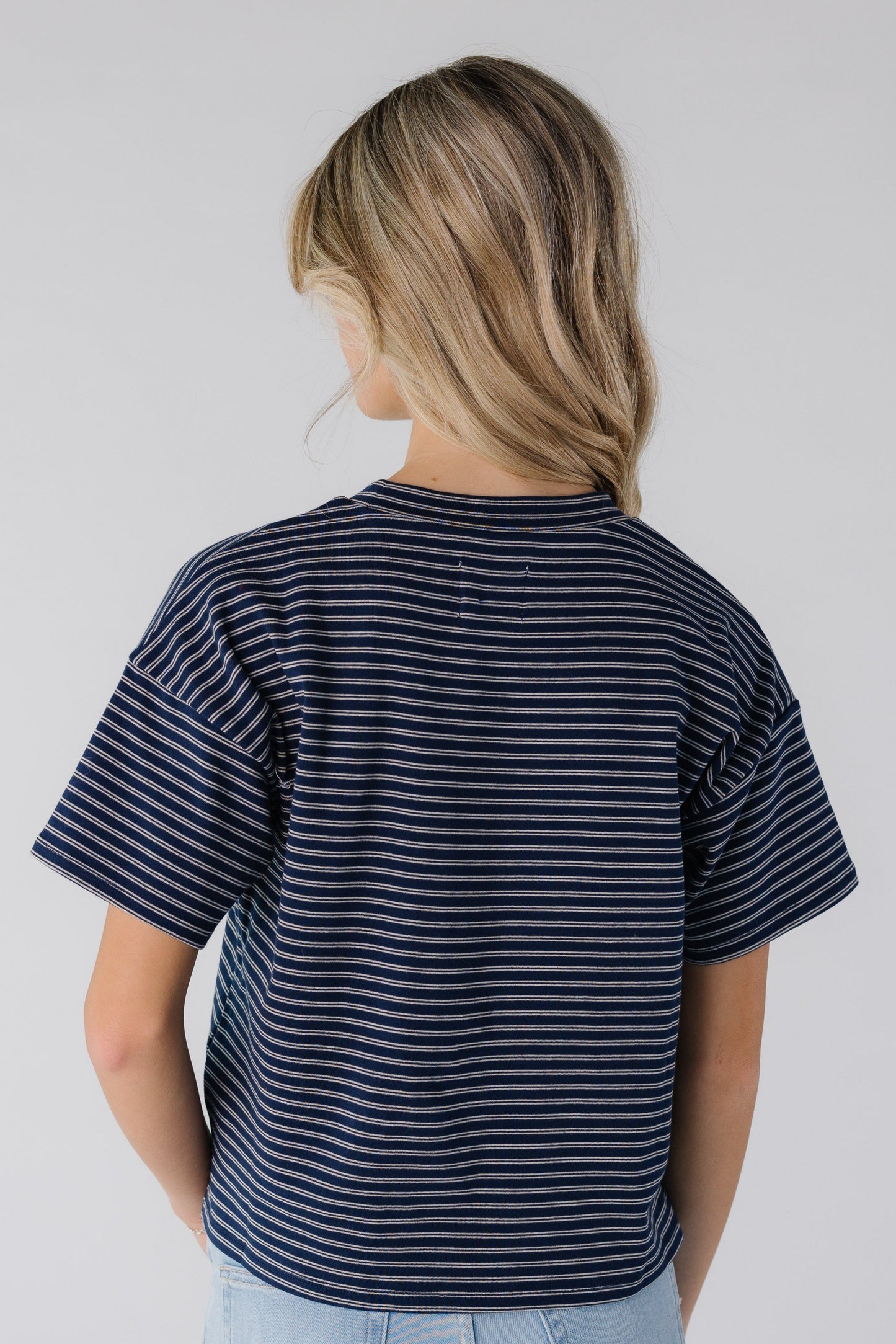 Back view of navy and white stripe boxy tee