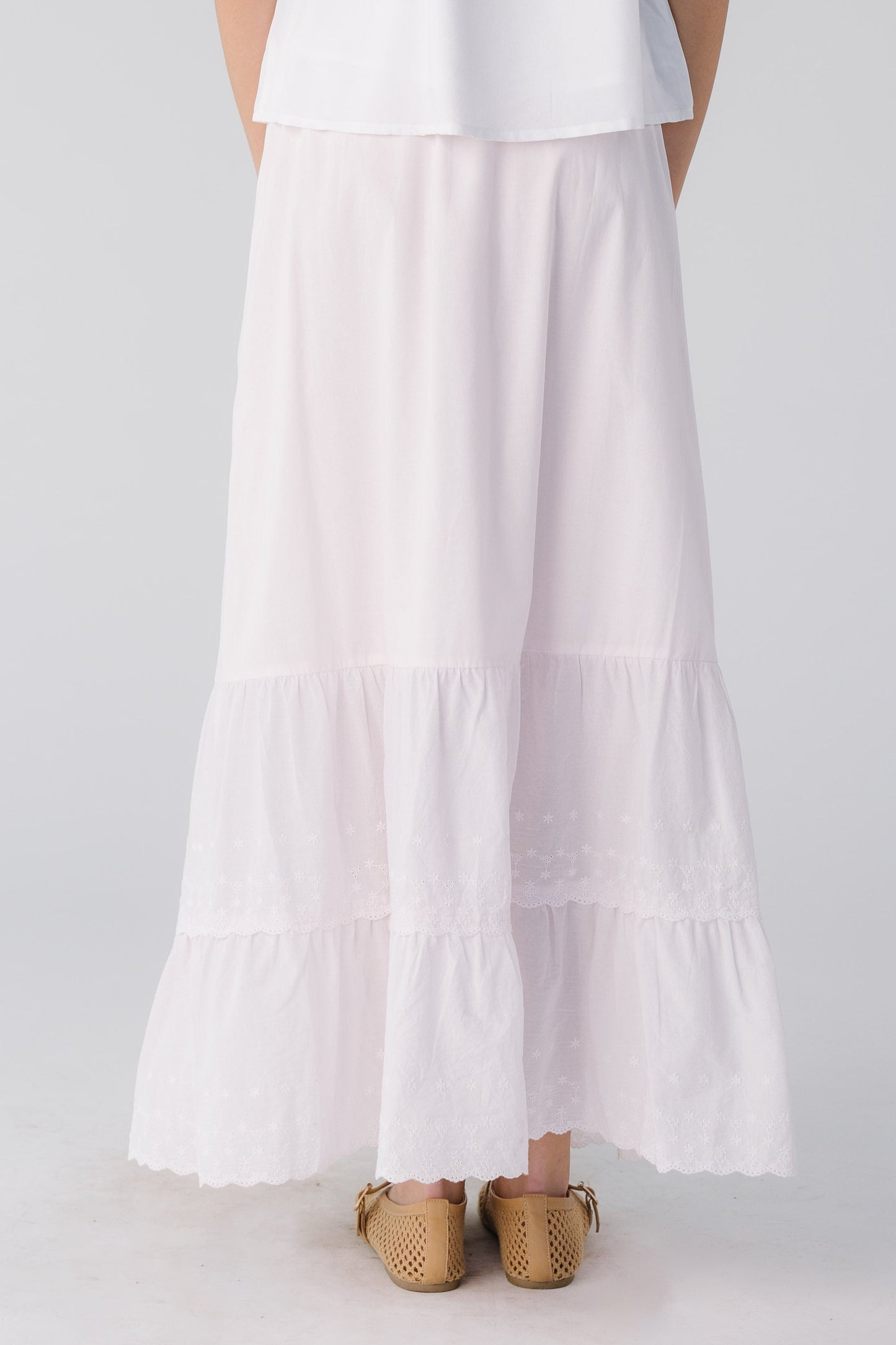 Back view of light pink eyelet ruffle skirt