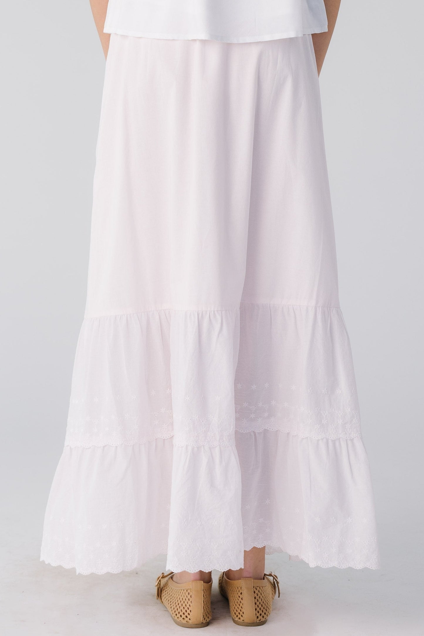 Back view of light pink eyelet ruffle skirt