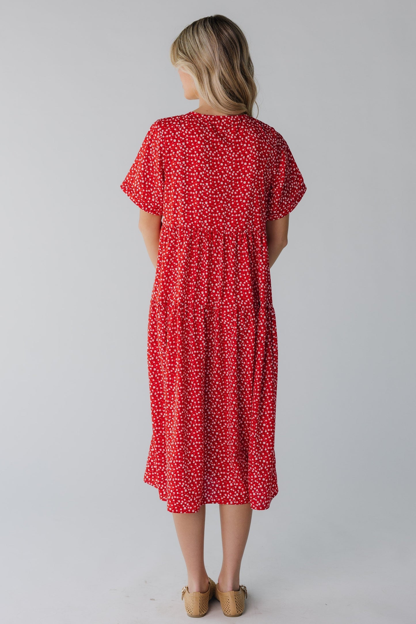 Back view of red floral midi with short sleeves