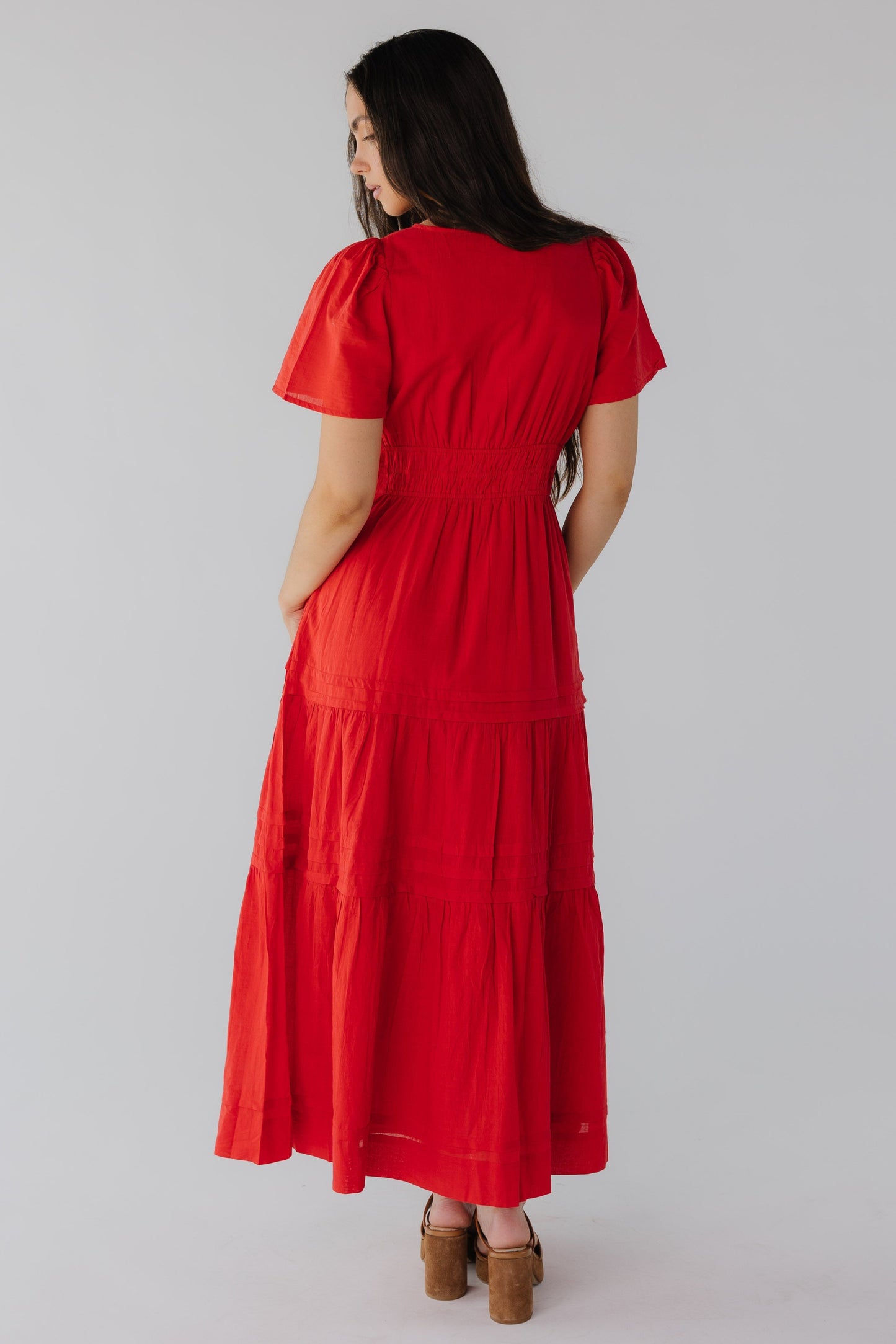 Back view of red tiered maxi with short sleeves