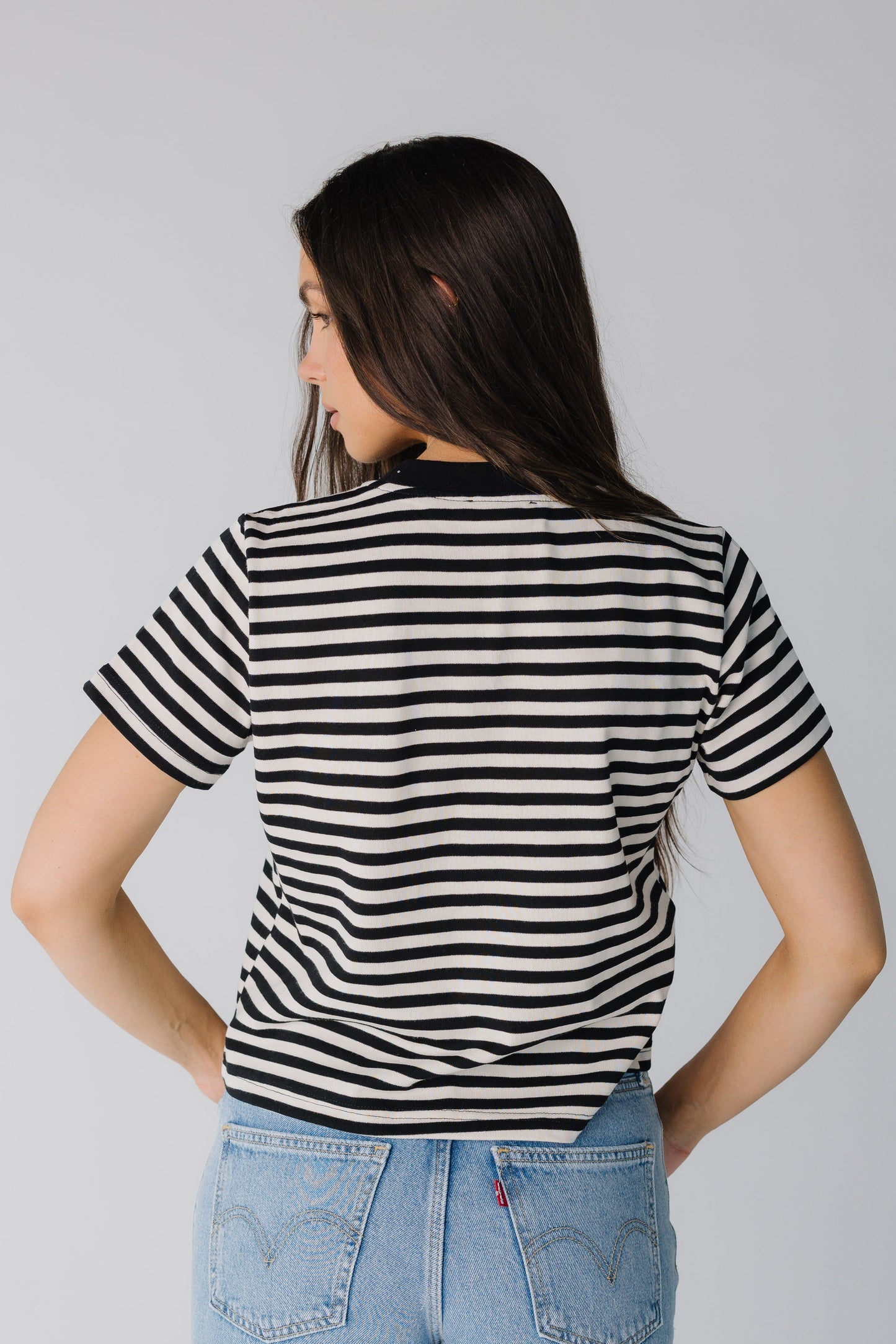 Back view of black and white stripe tee