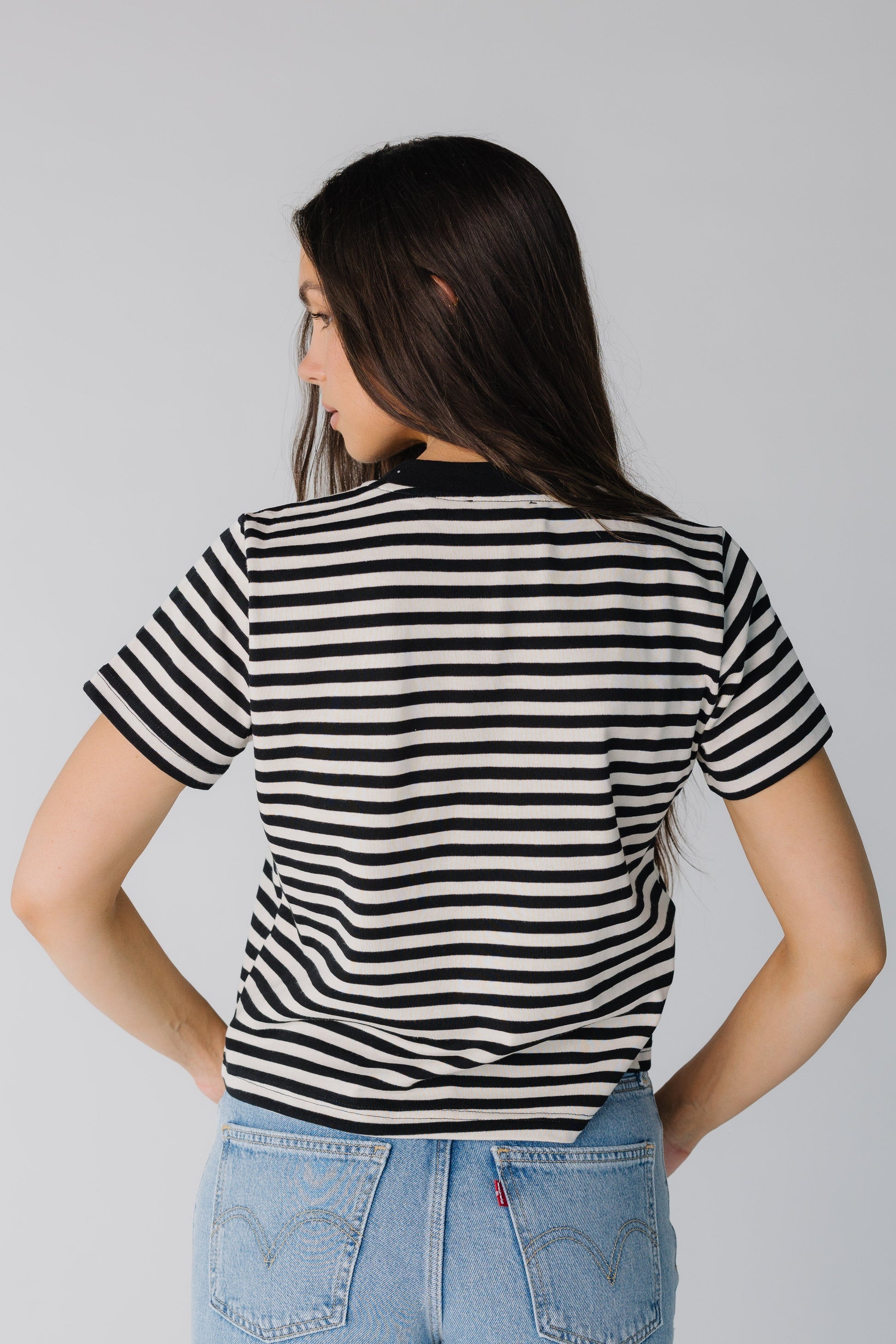 Back view of black and white stripe tee
