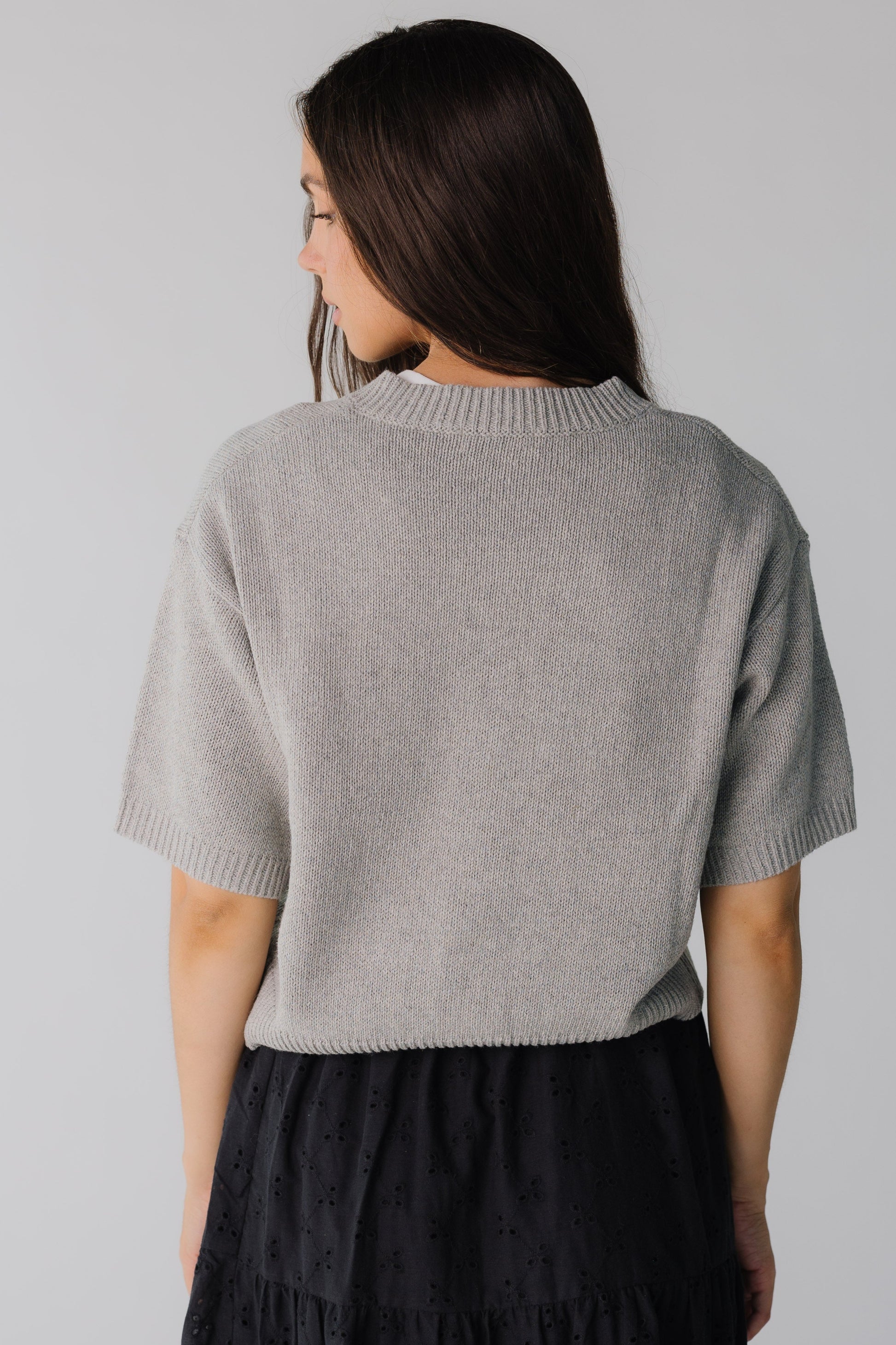 Back view of heather grey cardigan with wide ribbed waist and elbow length sleeves