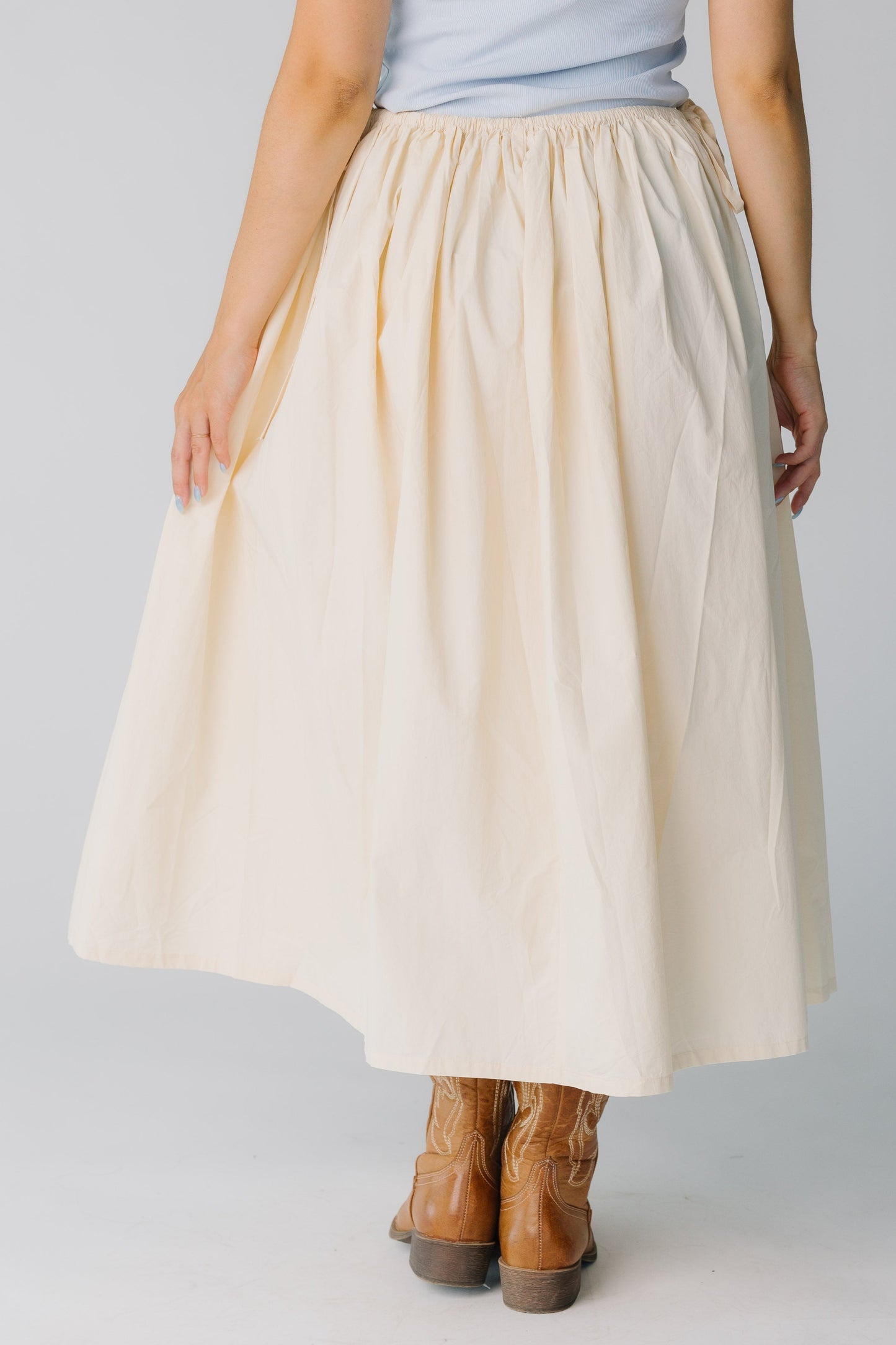 Back view of very full natural cream midi skirt