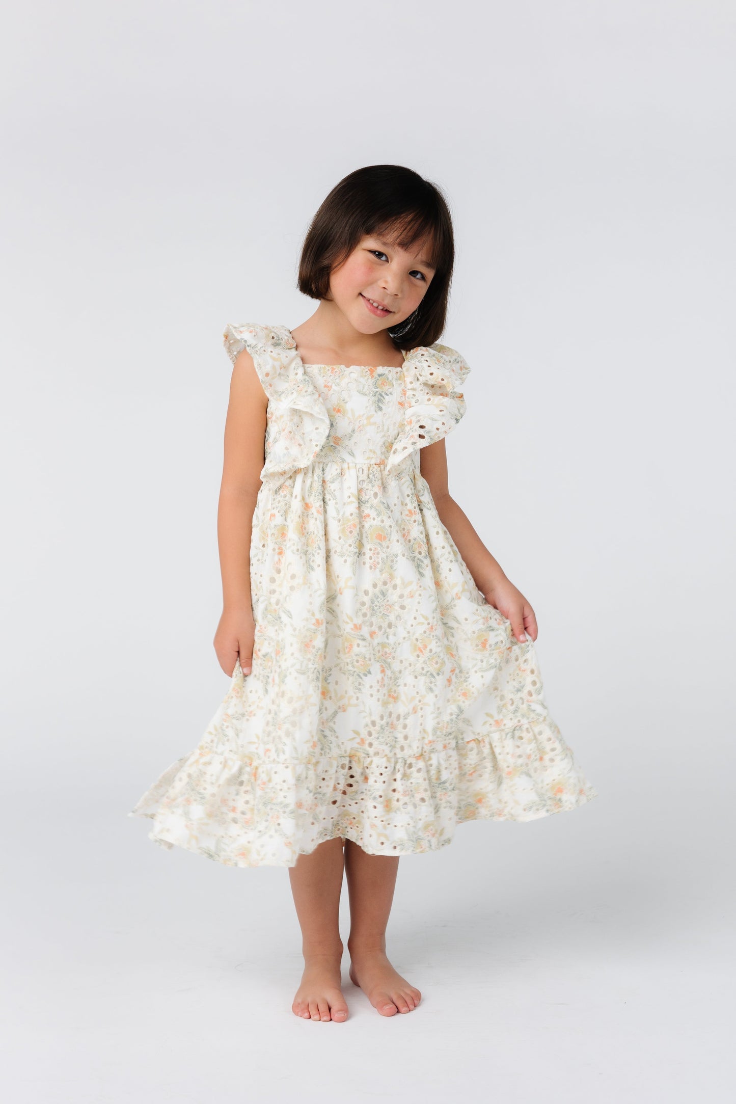 Sweet girl's floral print dress with ruffled angel sleeves