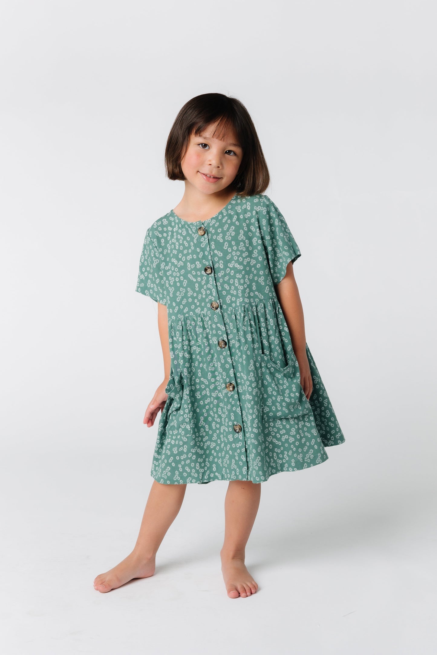Sweet button down dress for little girl's with large front pockets