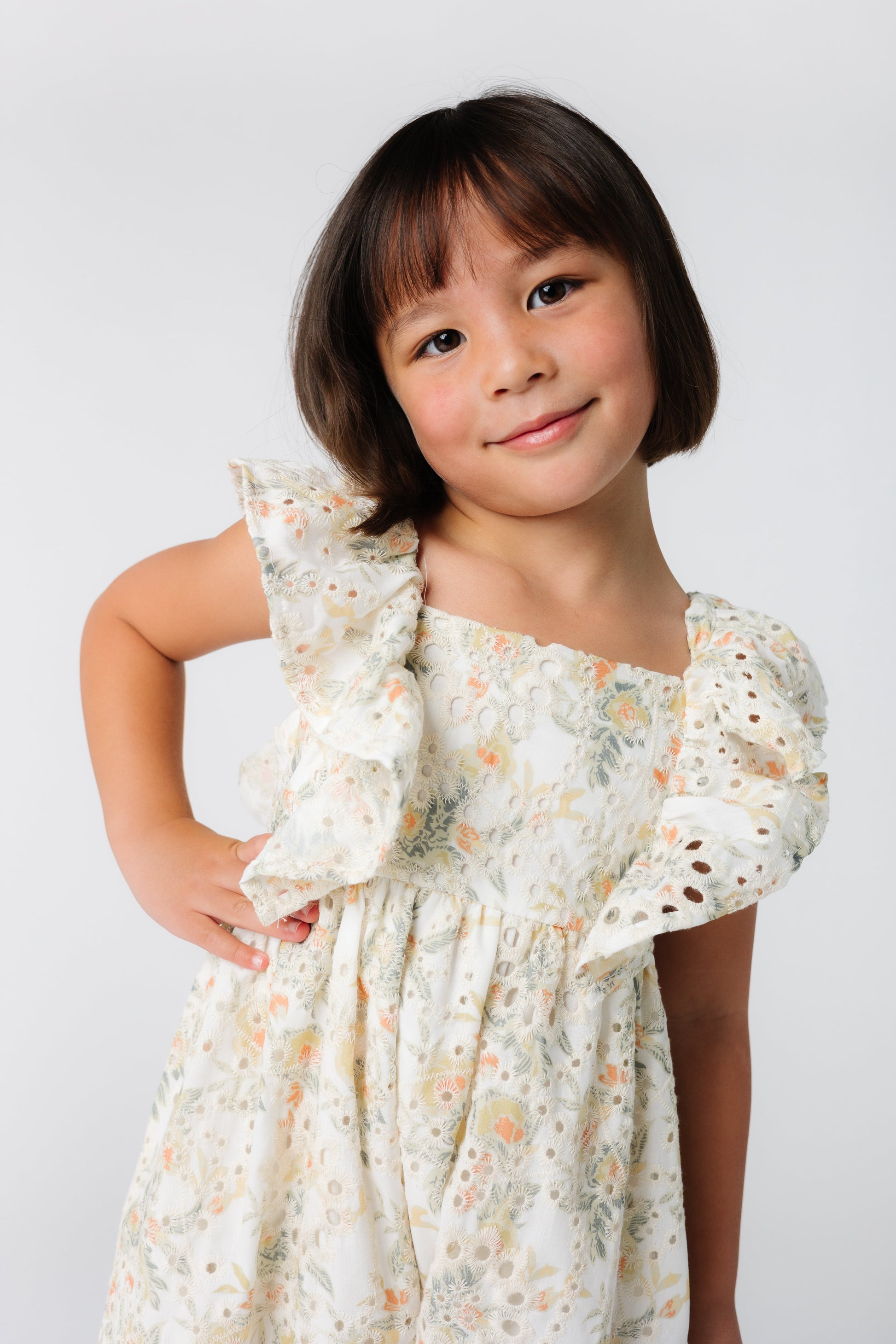 Floral eyelet girl's dress with angel sleeves and full skirt