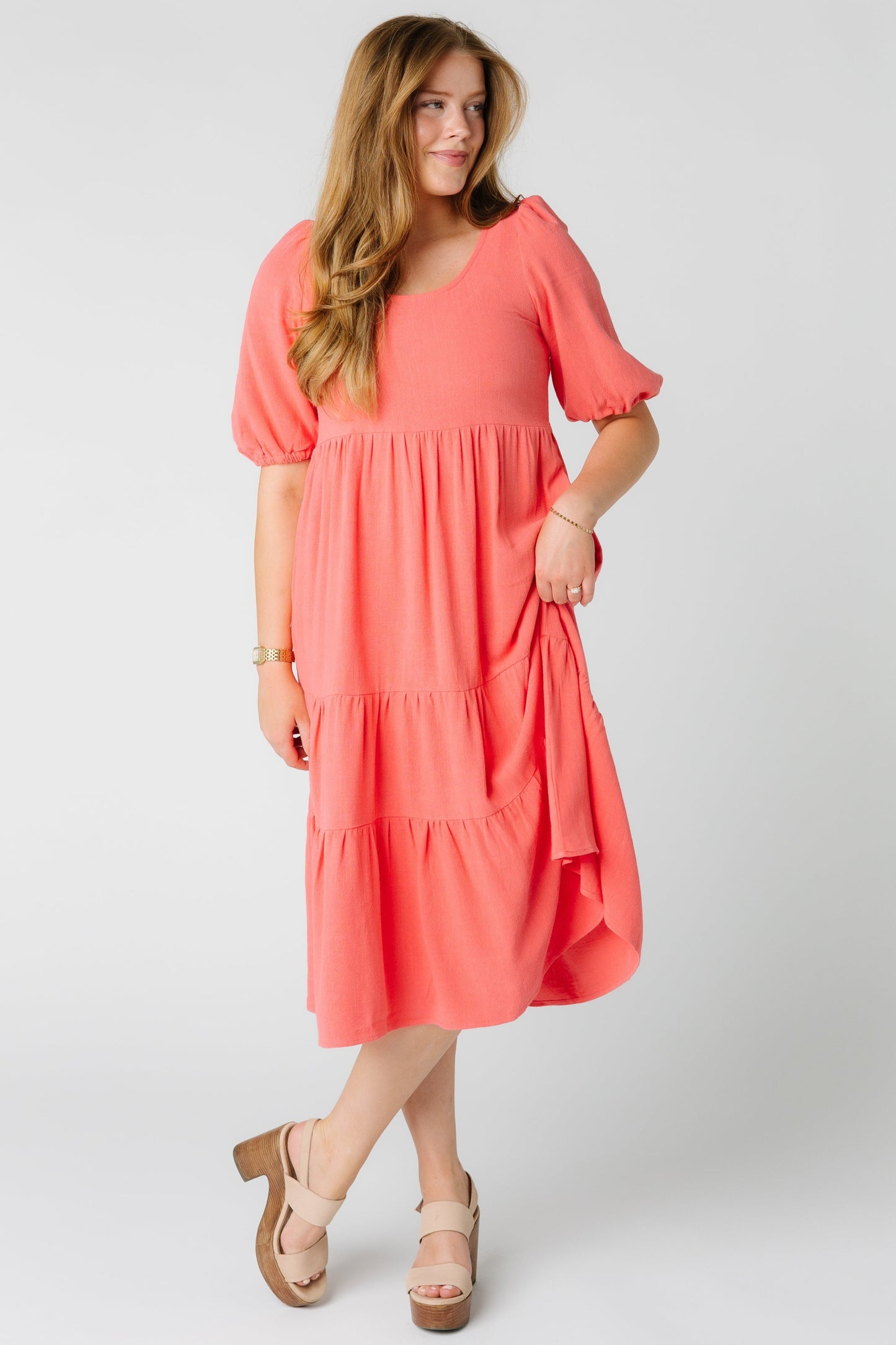 Coral midi dress with scoop neckline and multiple tiers