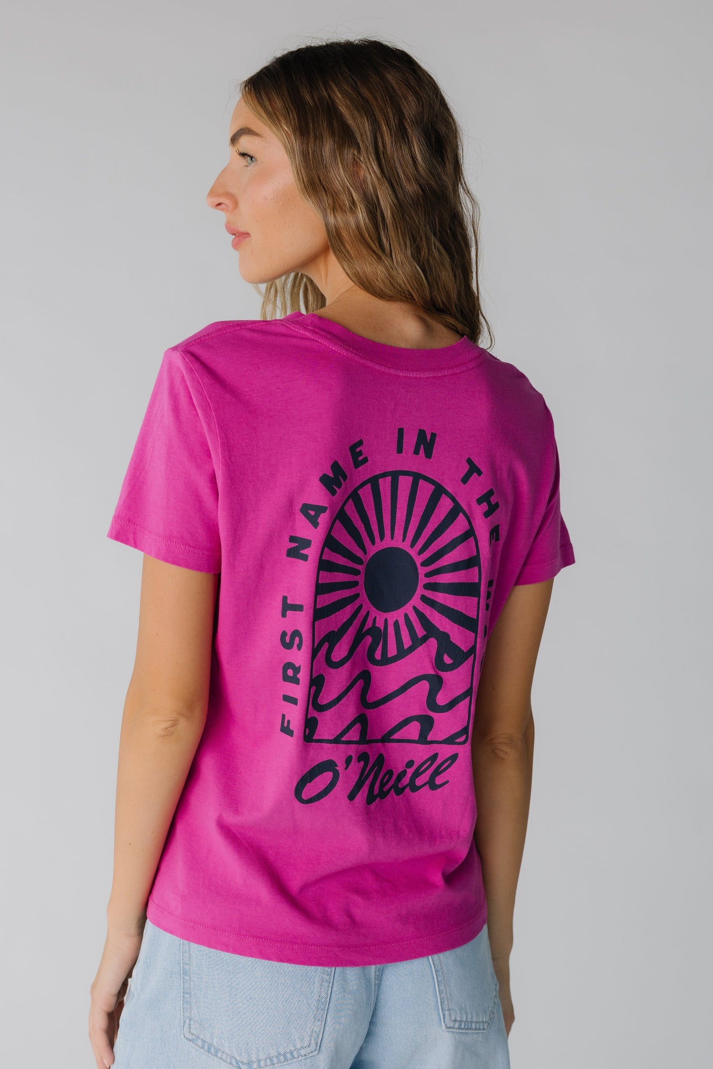 Back view of bright pink graphic tee by O'Neill