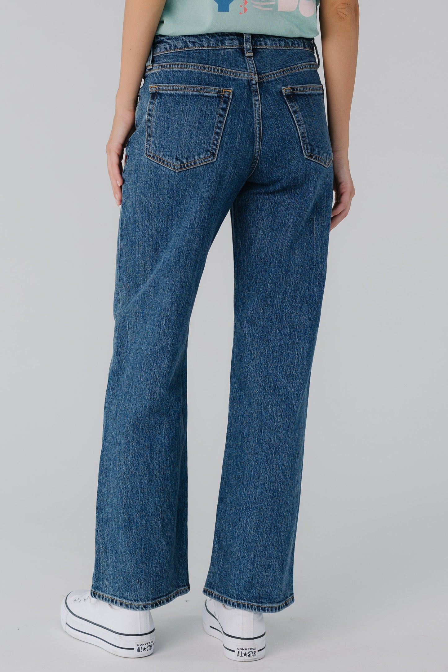 Back view of dark denim straight leg jeans