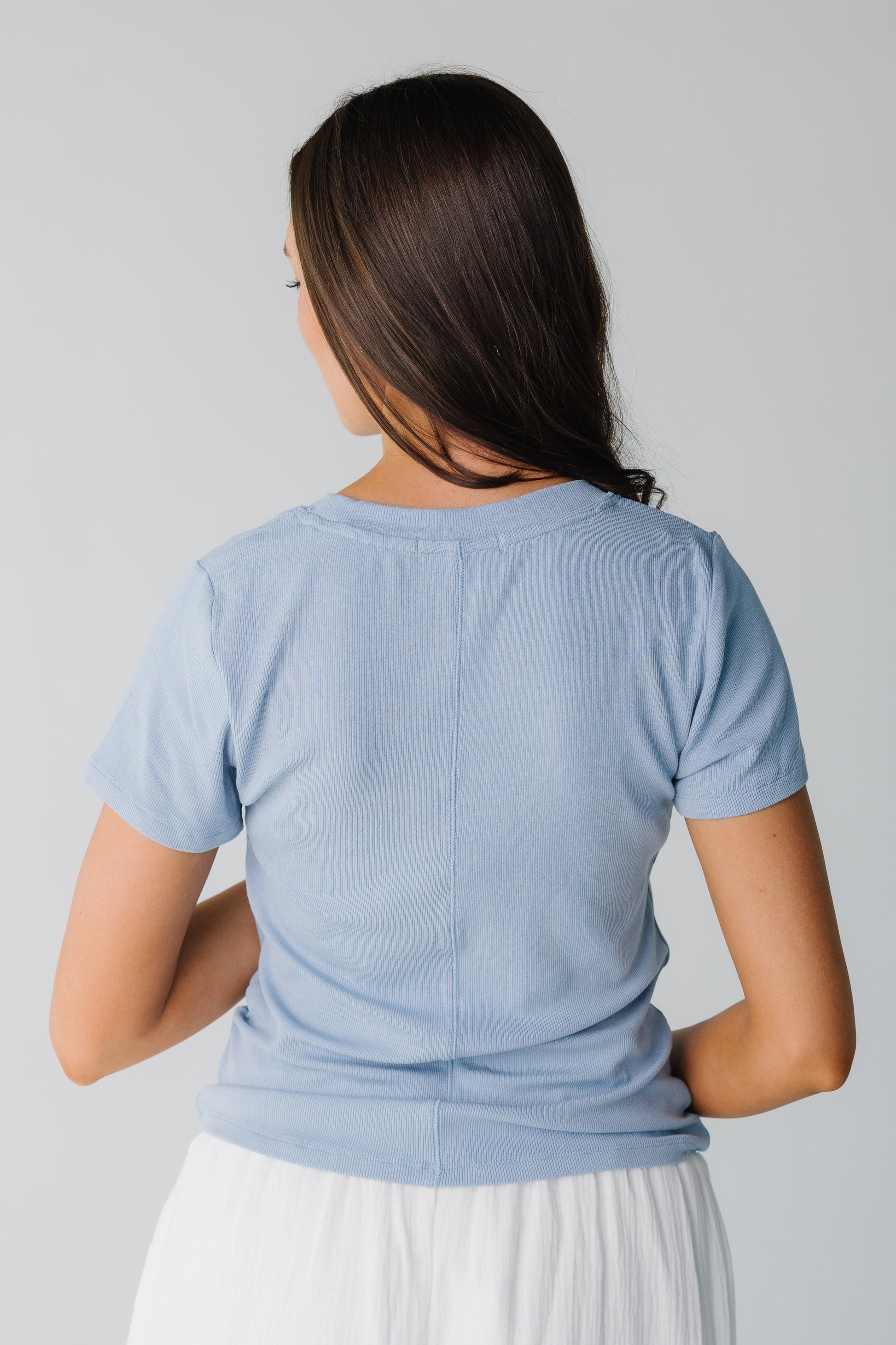 Back view of light blue ribbed top with short sleeves
