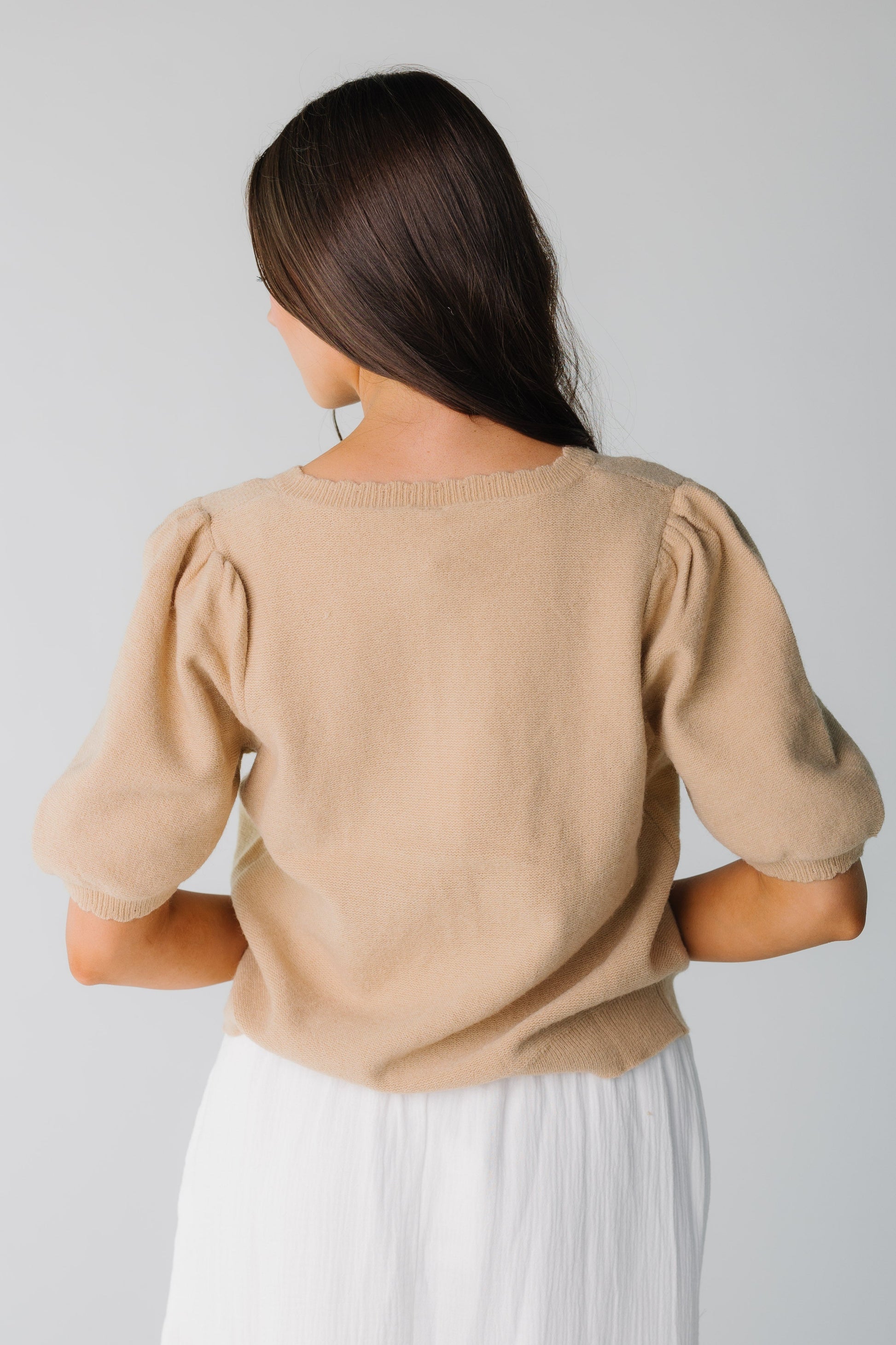 Back view of taupe puff sleeve sweater