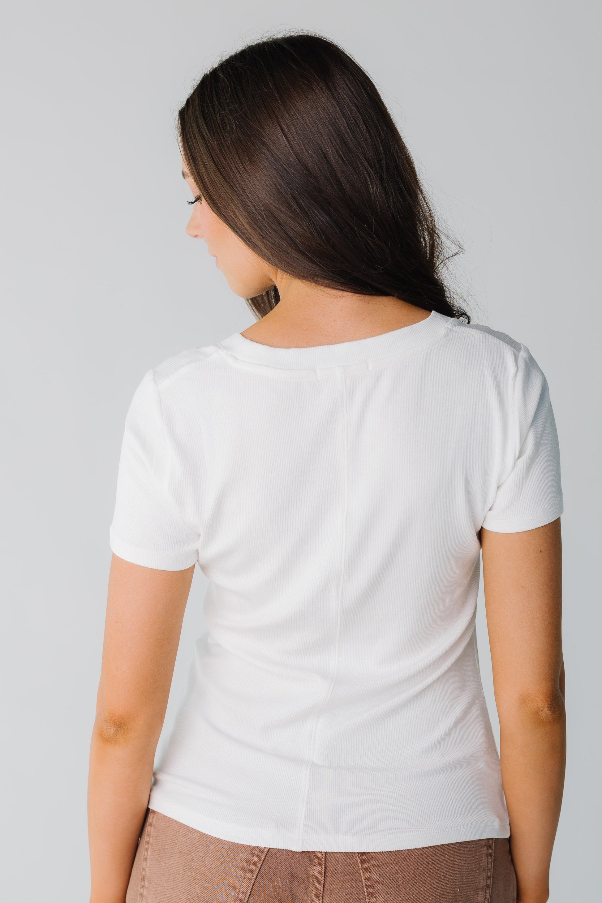 Back view of white ribbed top with short sleeves