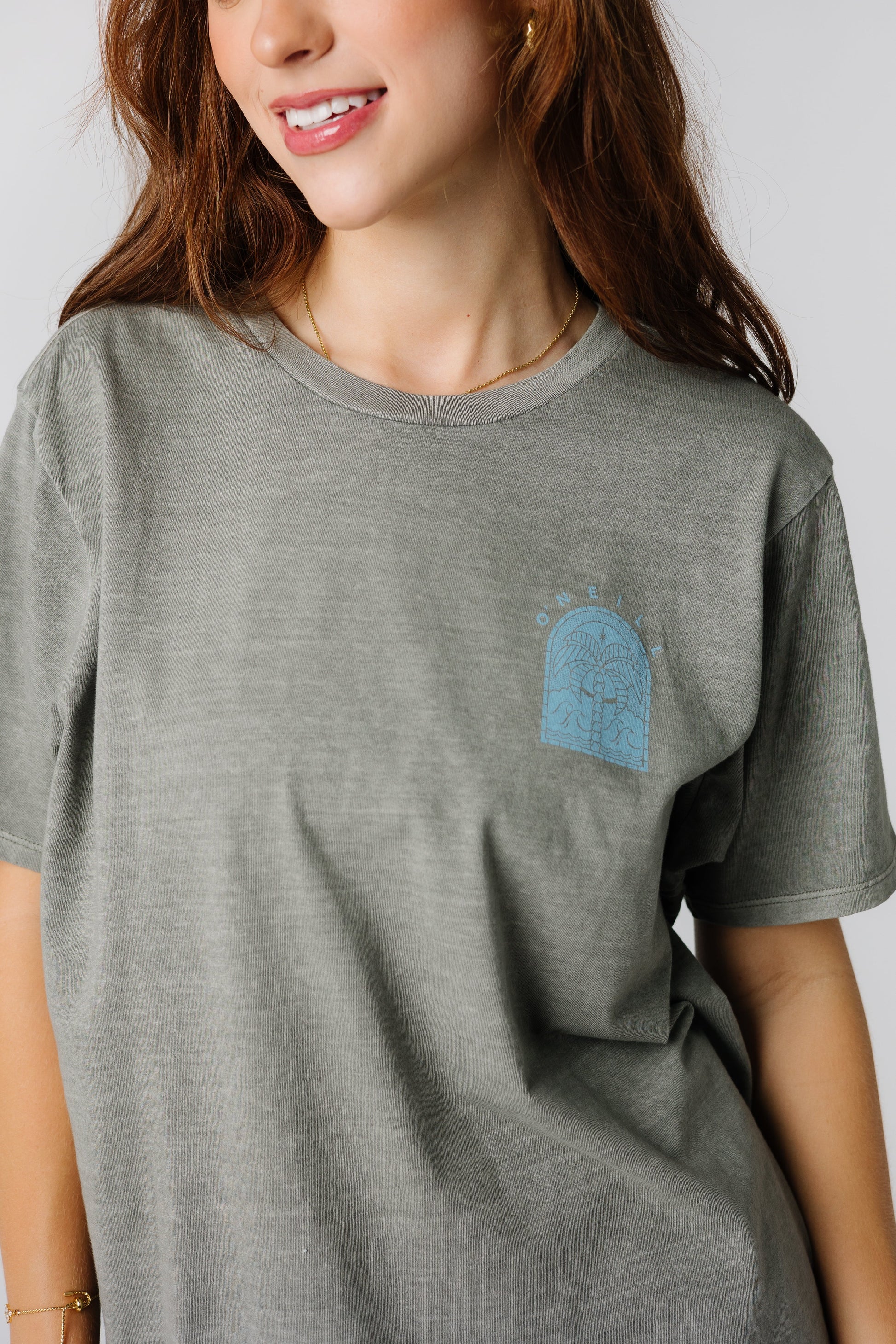 Close up view of grey O'Neill graphic tee with small front blue graphic