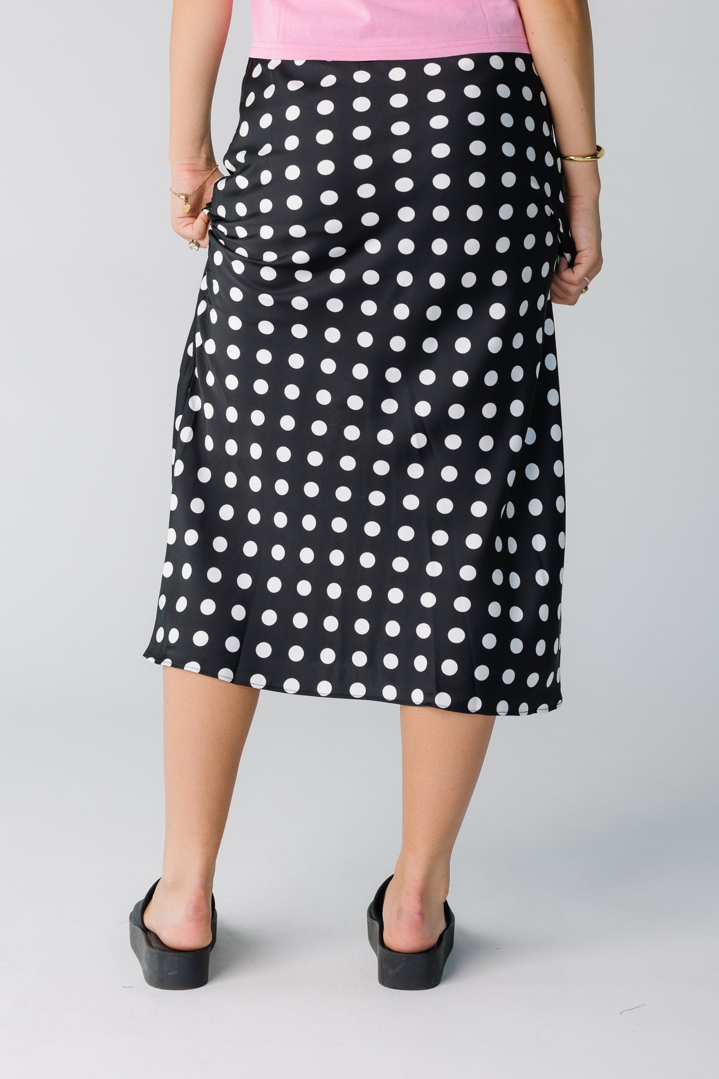 Back view of black and white polka dot skirt