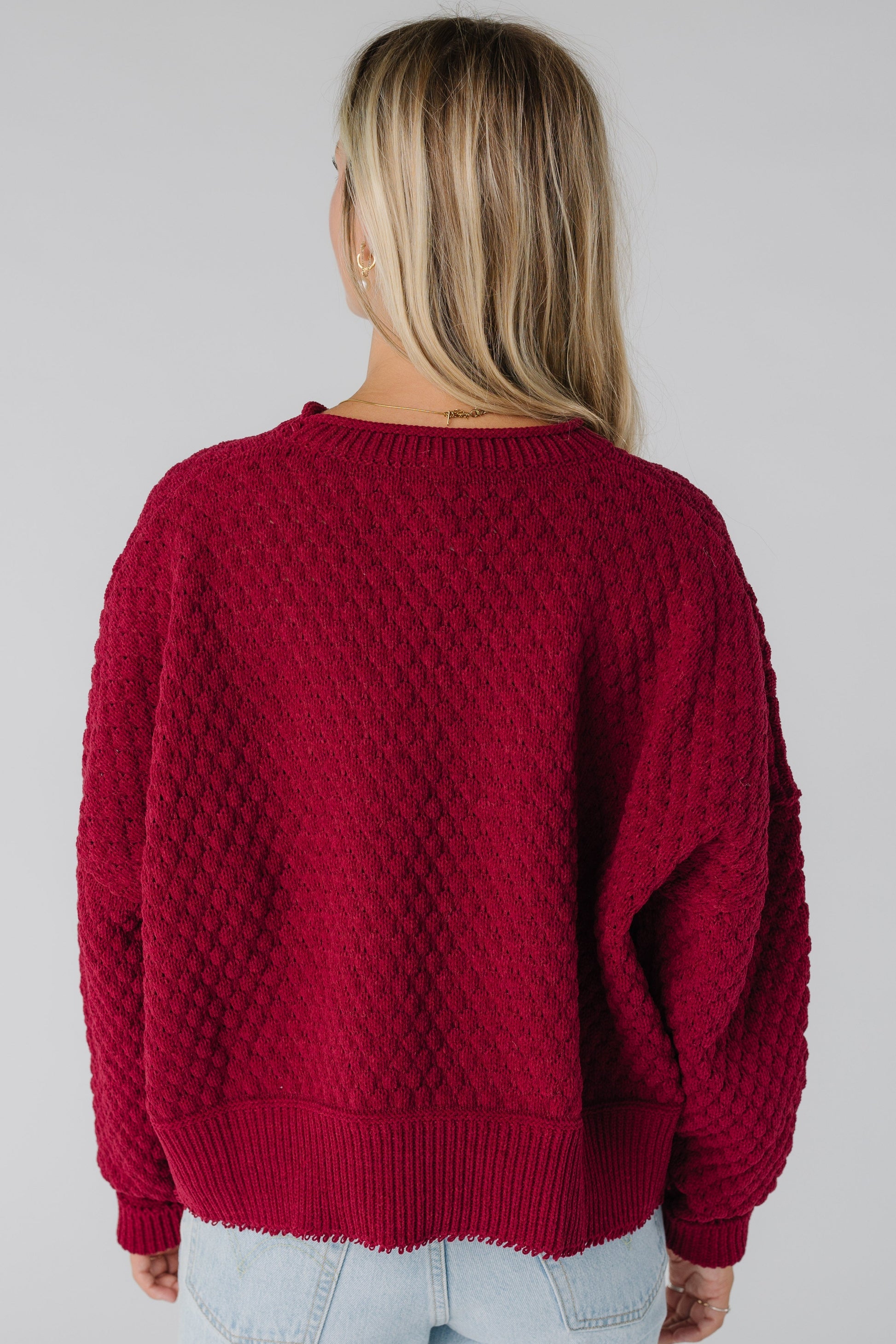 Back view of wine textured sweater