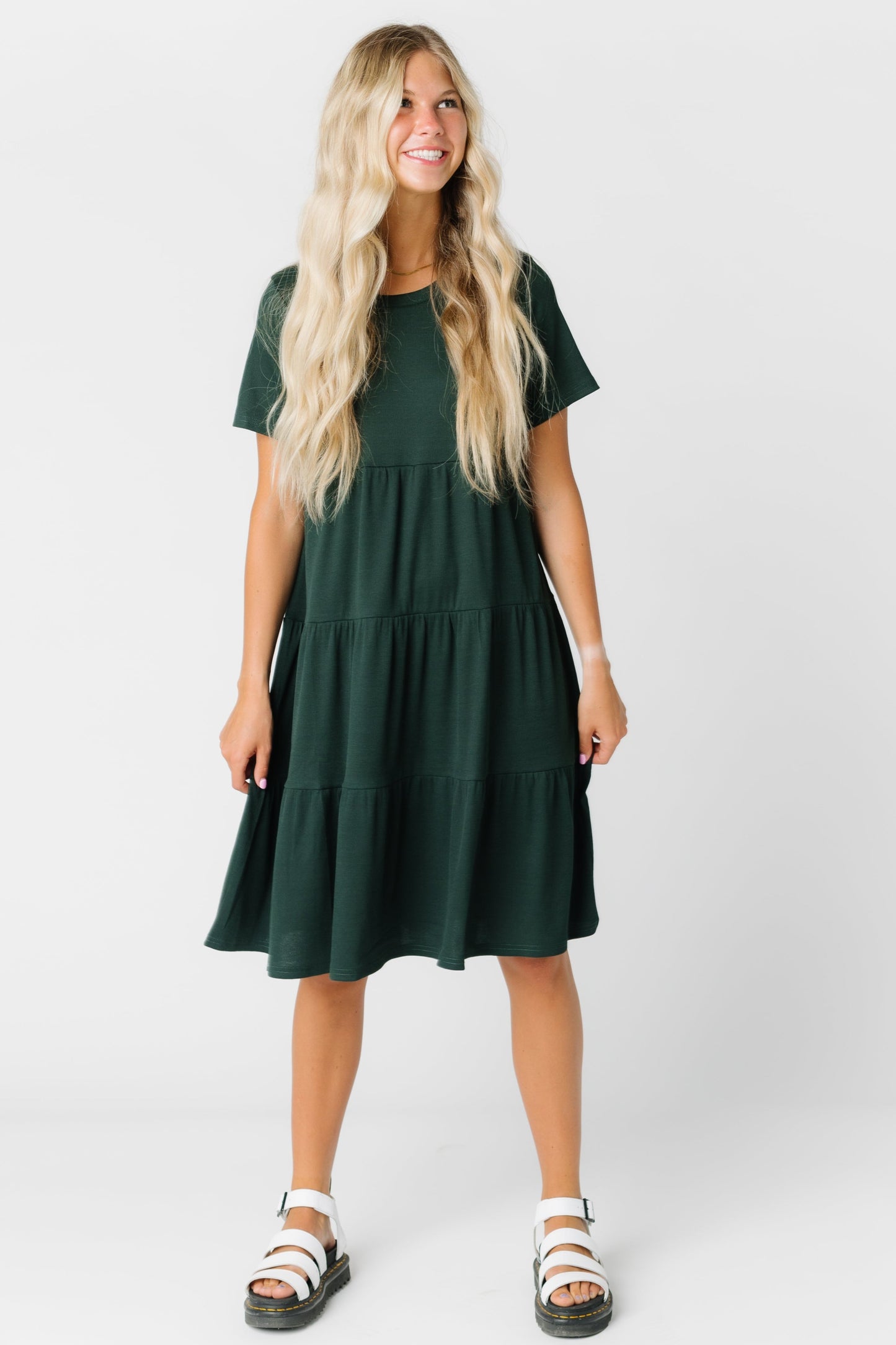 Modest women's tiered dress with round neckline and short sleeves in dusty green