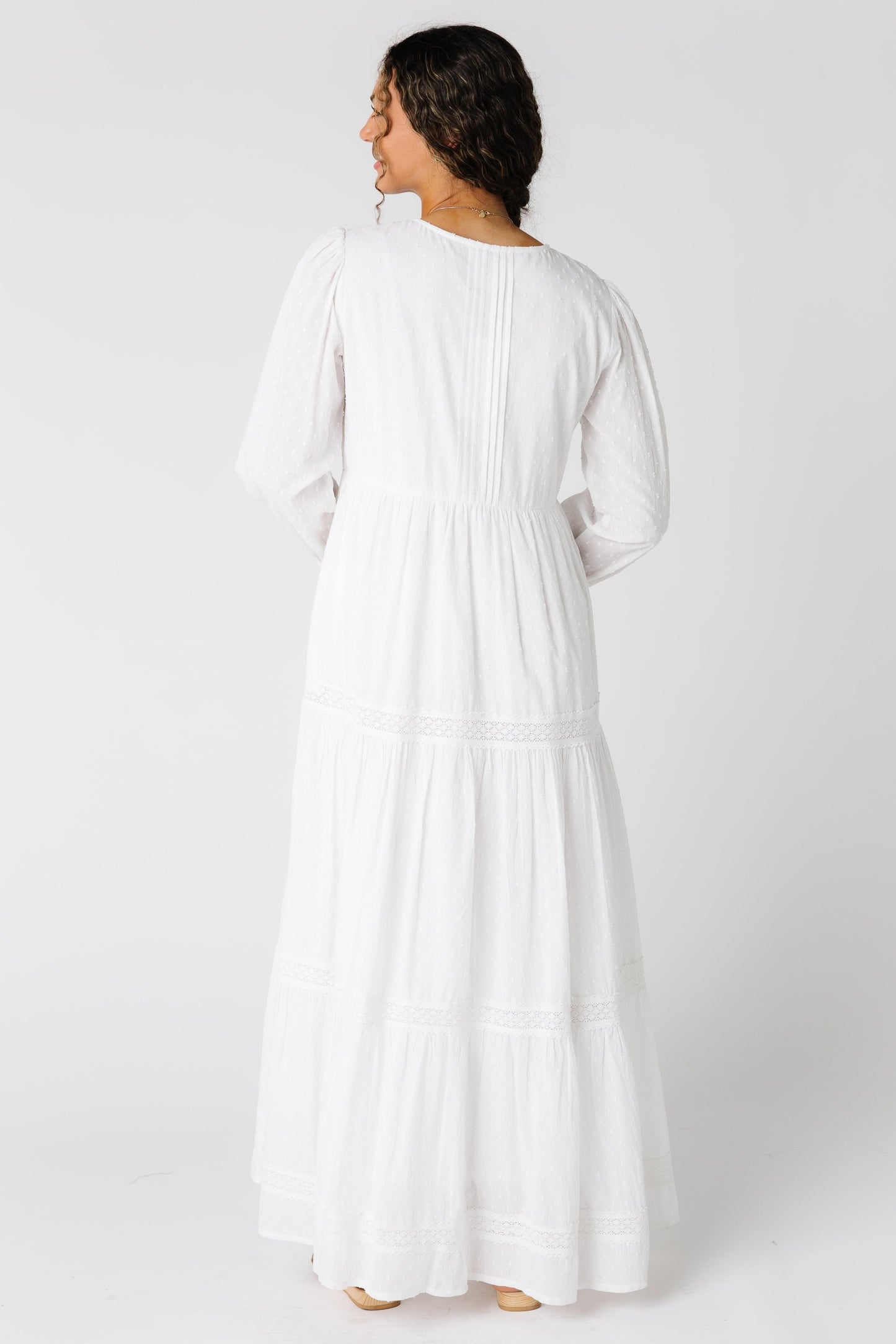 Back view of all white maxi