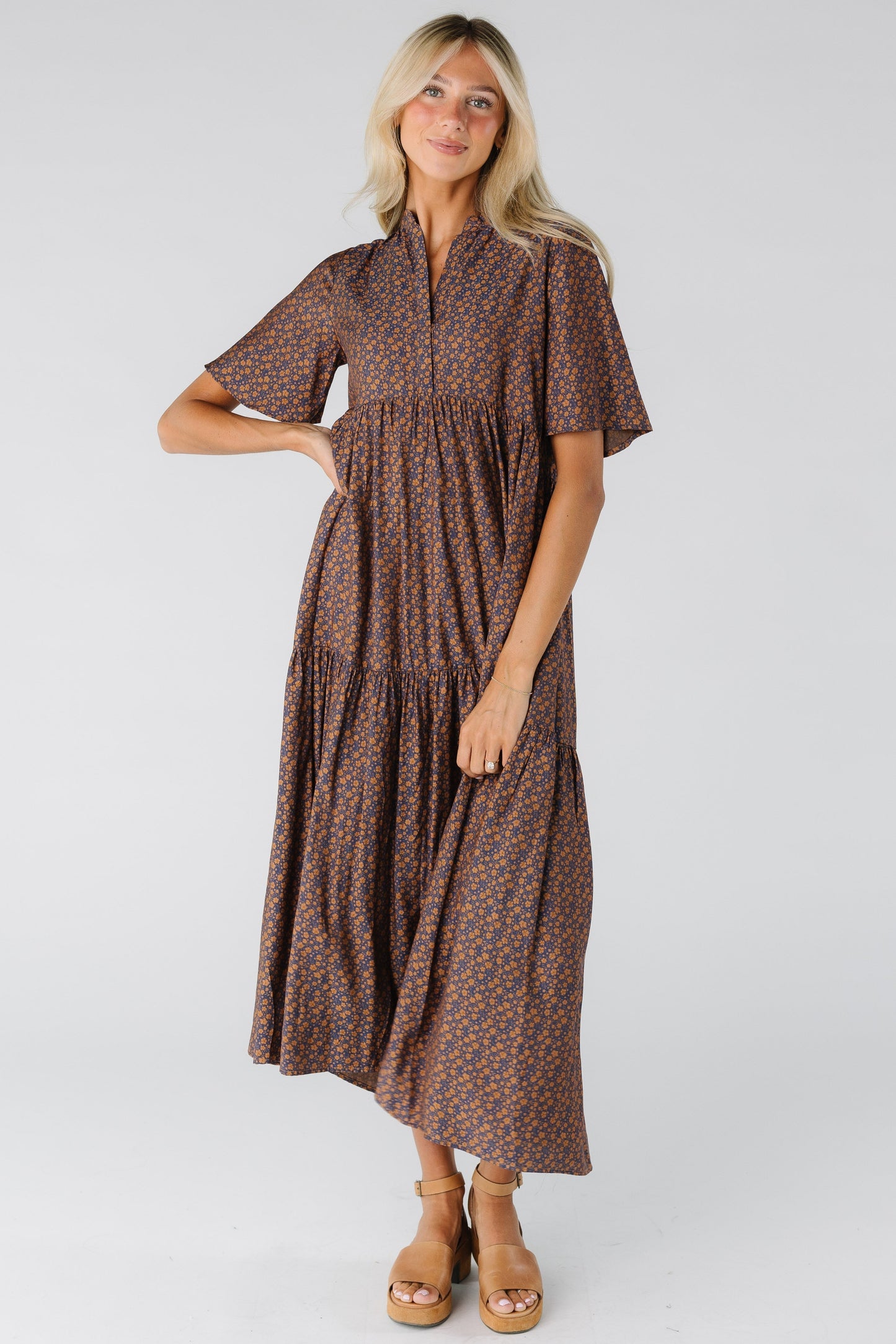 Woman wearing a floral print midi dress with short sleeves