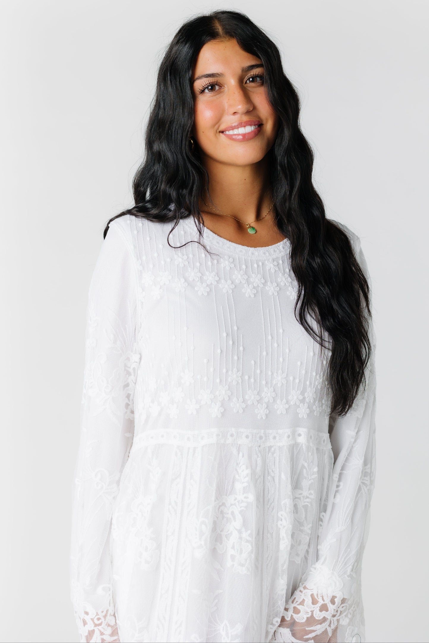 Close view of modest all white lace maxi dress