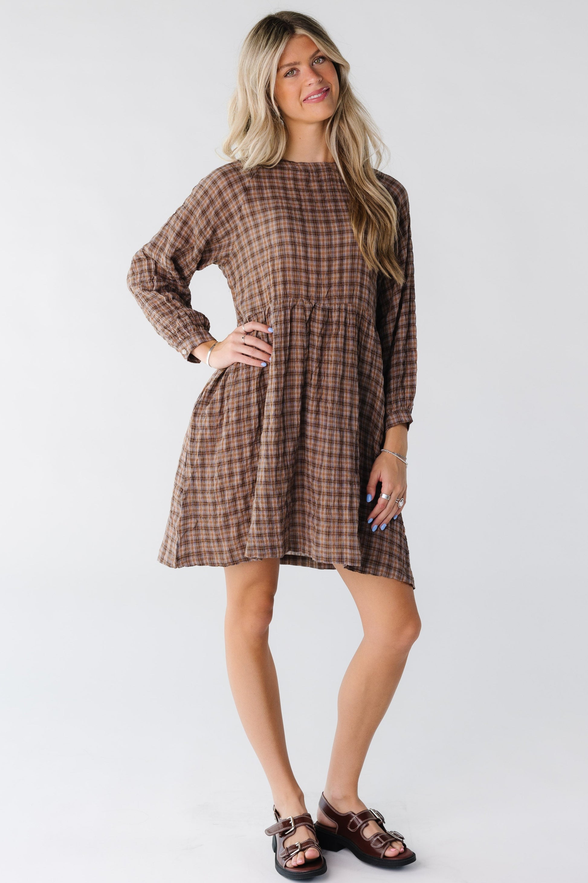 Modest women's knee length dress with long sleeves and round neckline