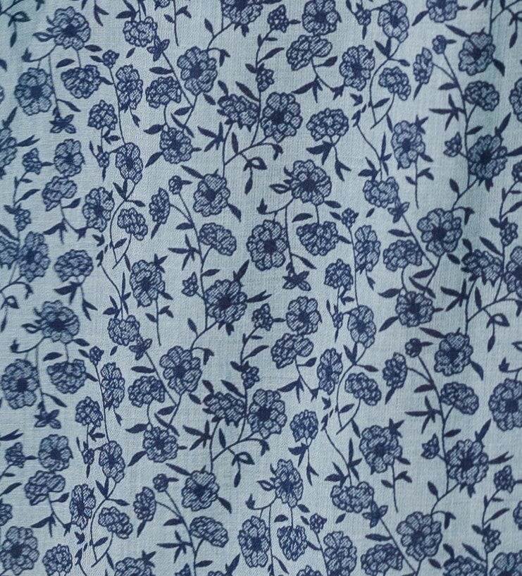 Blue floral print fabric swatch.