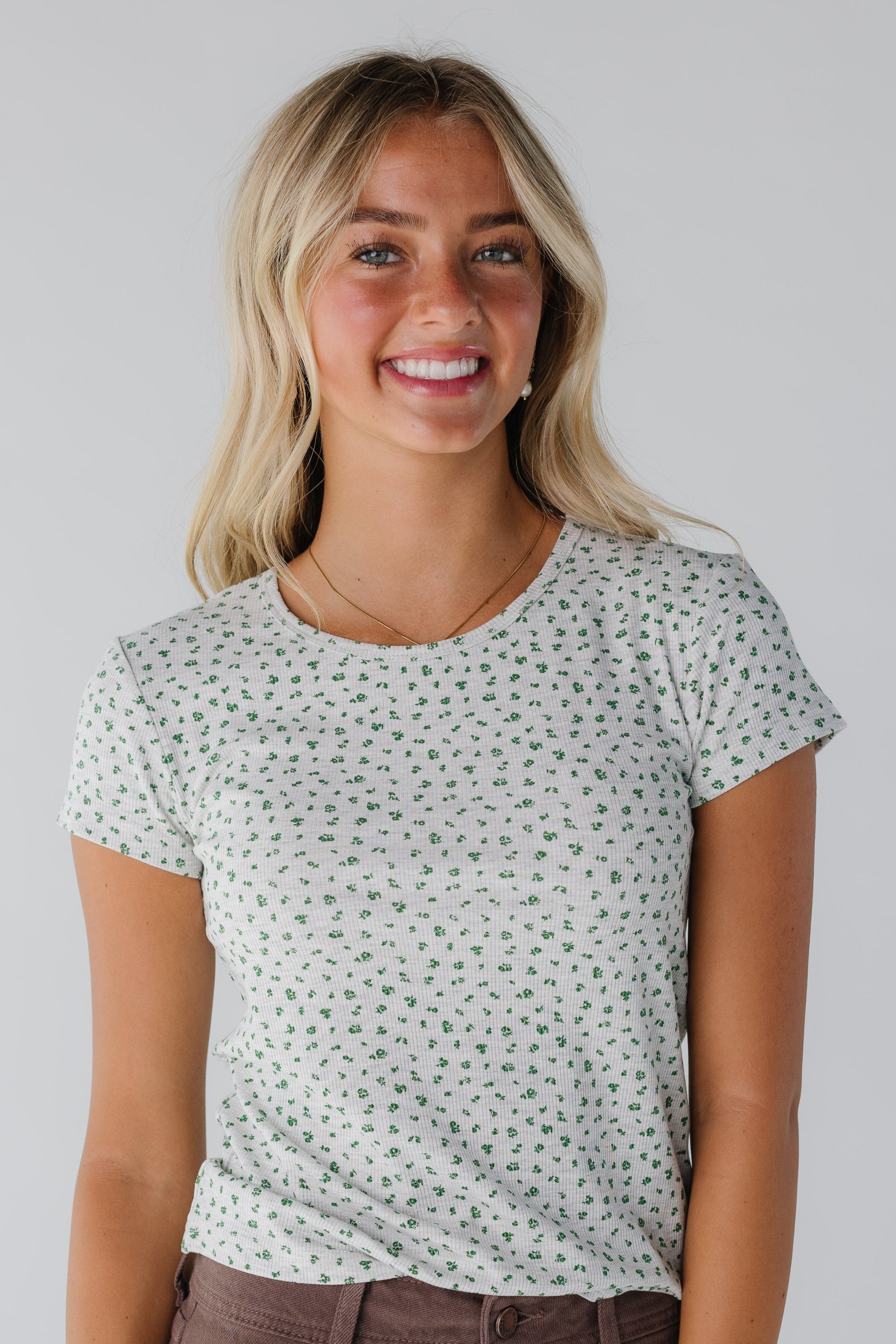 Modest women's floral print top with round neckline and short sleeves
